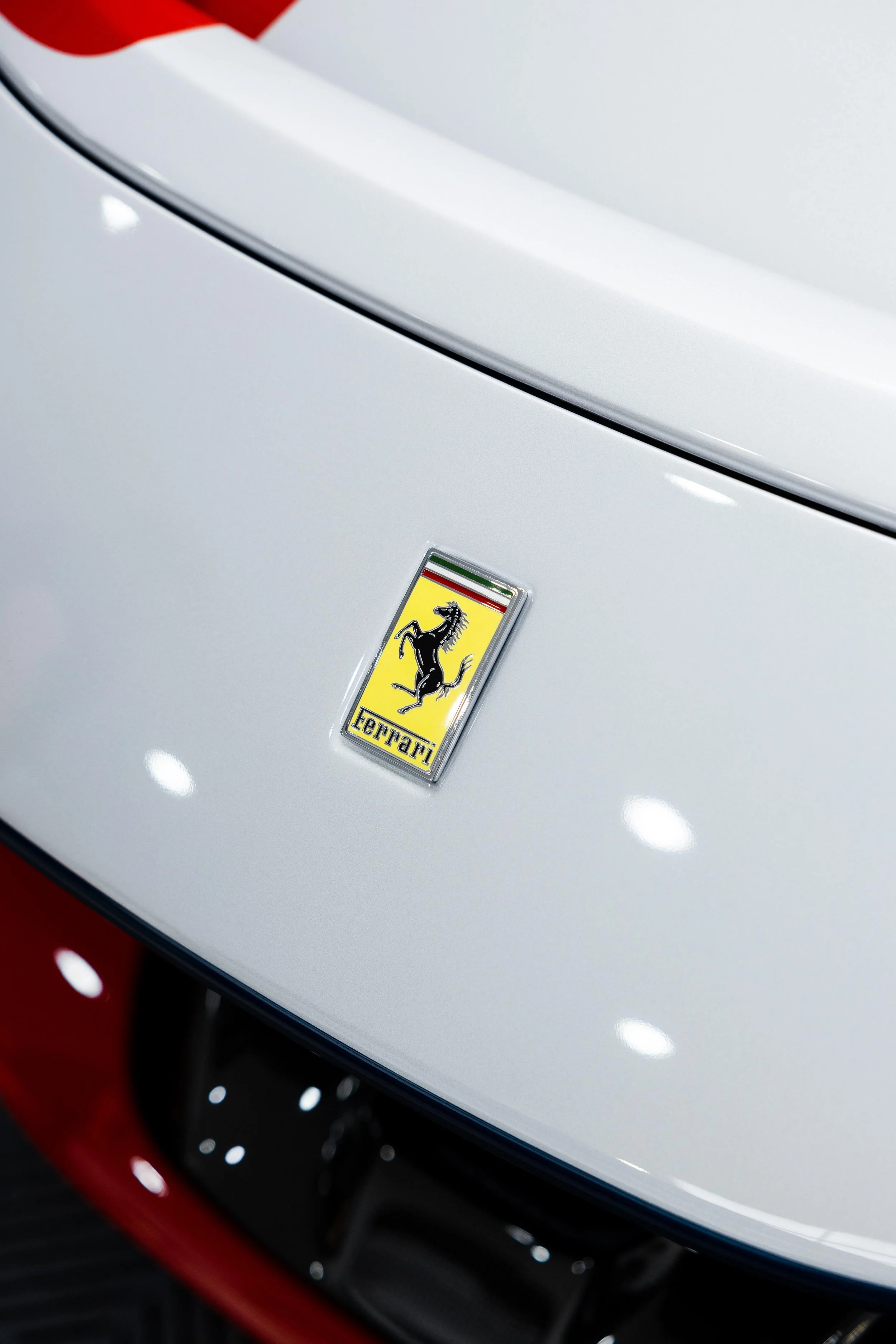 Red Ferrari SF90 Spyder white nose and Prancing Horse badge with XPEL Paint Protection Film in Mona Vale