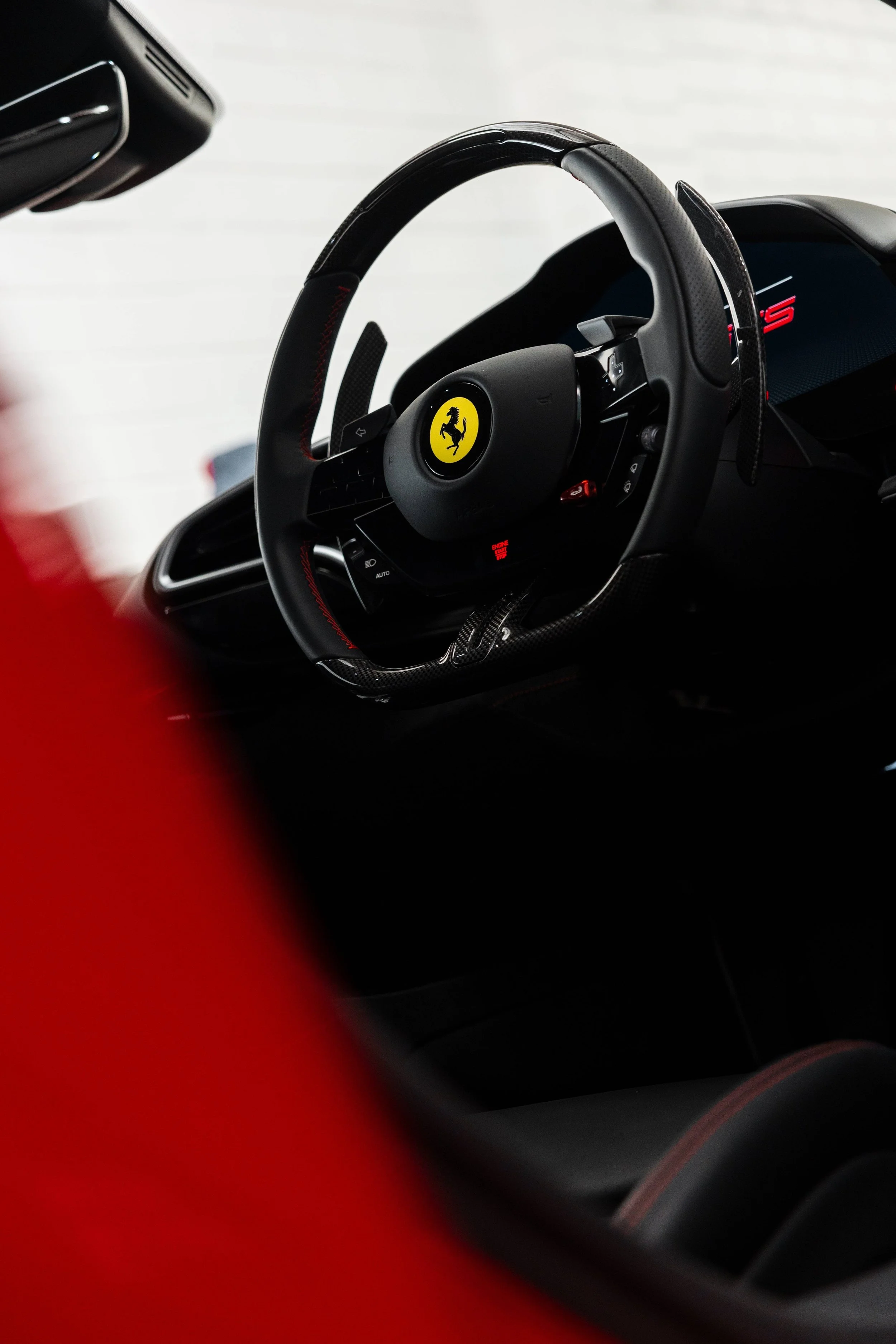 Red Ferrari 296 GTS interior detailing steering wheel and 296 GTS badge in Sydney