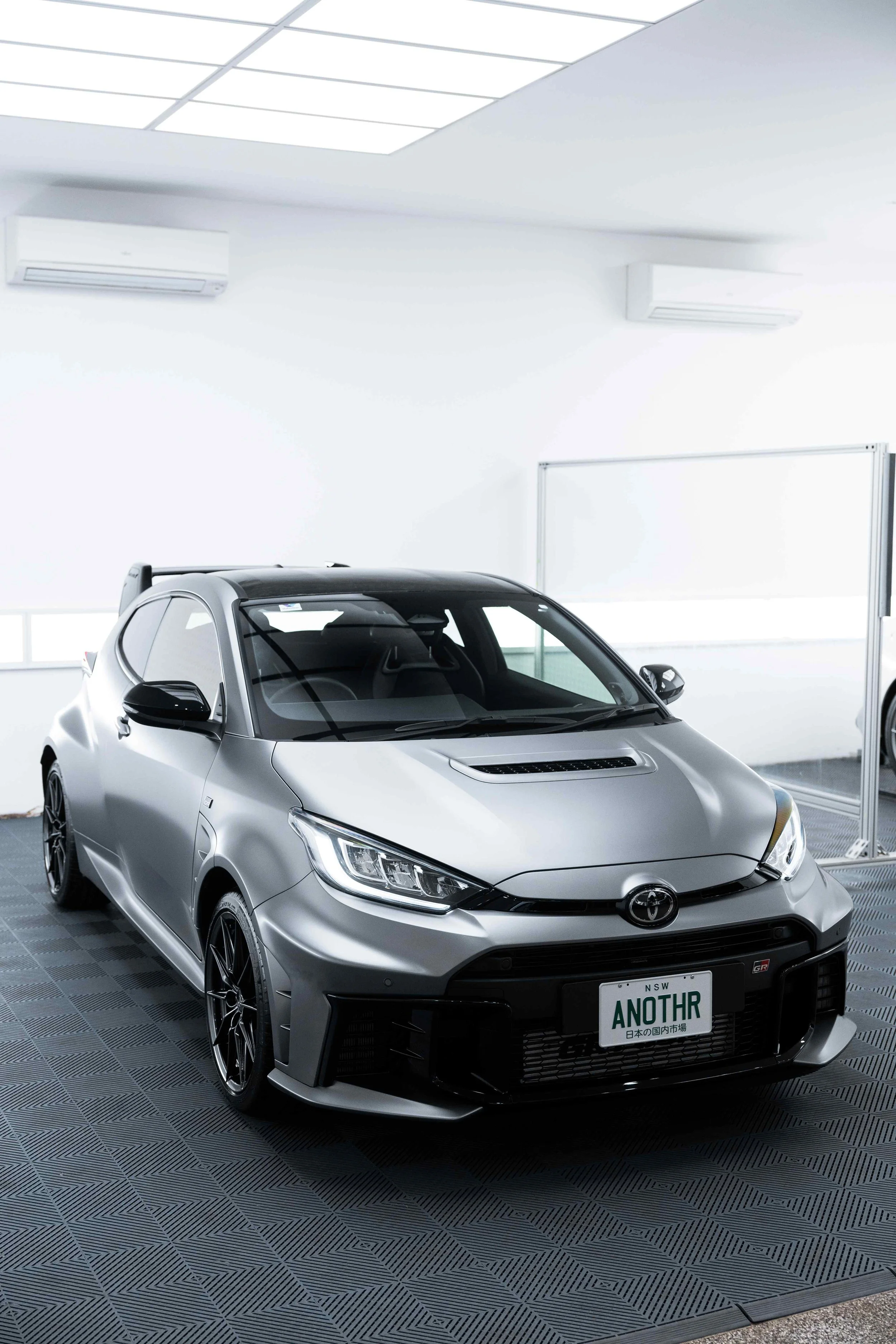 Matte grey Toyota GR Yaris front three quarter in studio with XPEL Paint Protection Film in Sydney