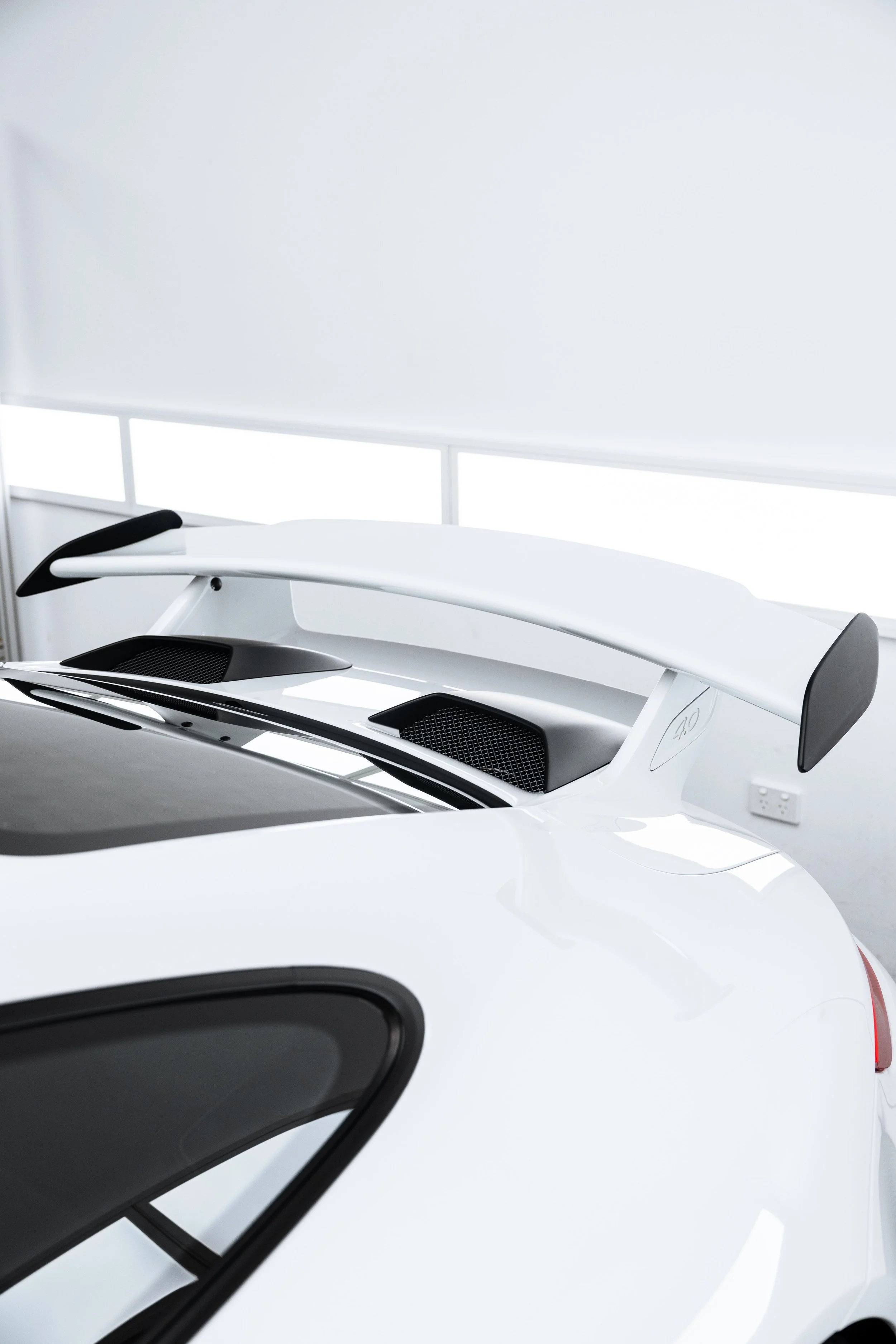 White Porsche GT3 rear wing and engine grille with XPEL Paint Protection Film in Mona Vale