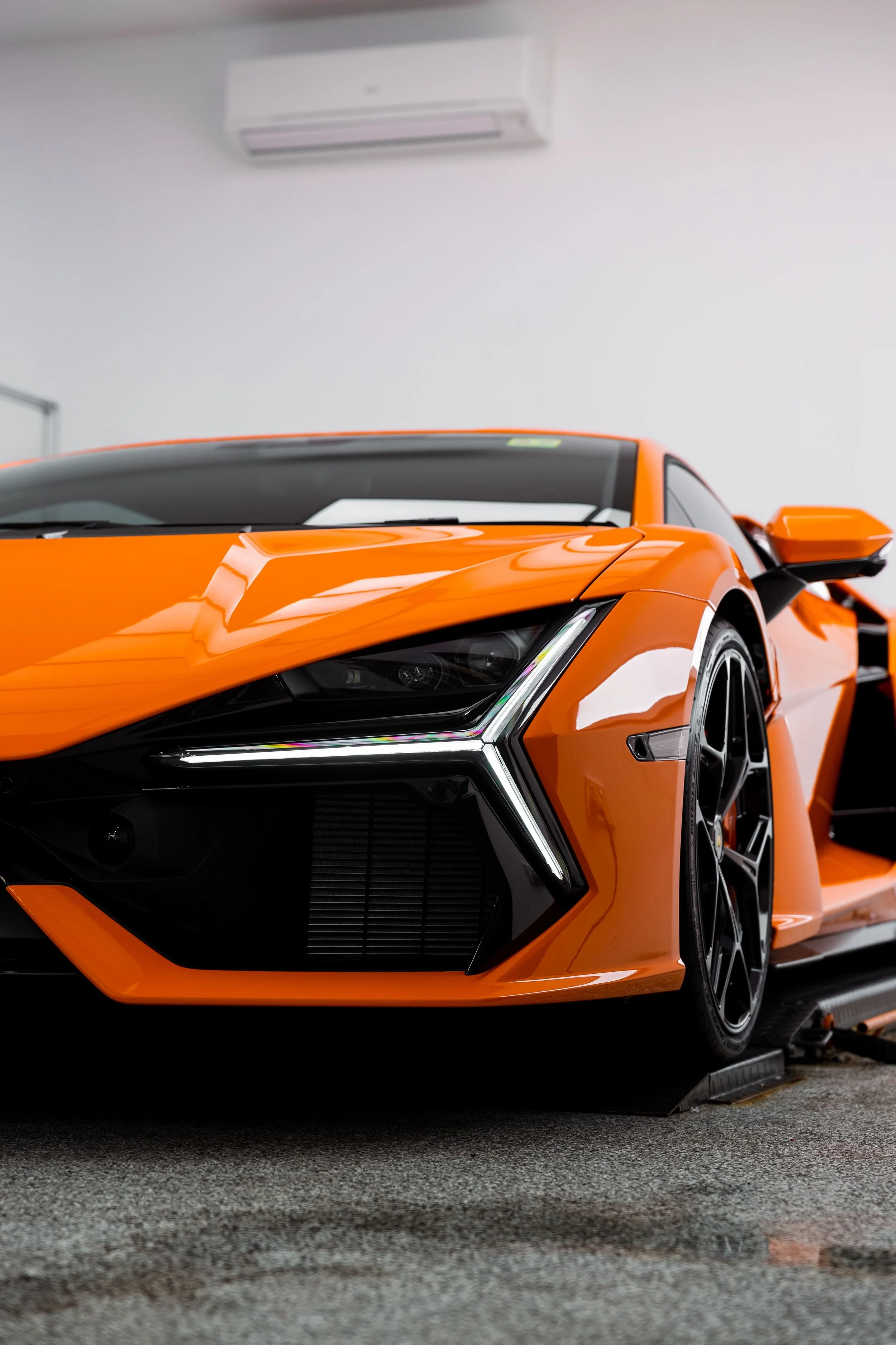 Orange Lamborghini Revuelto front quarter detail with full PPF by ADS in Mona Vale