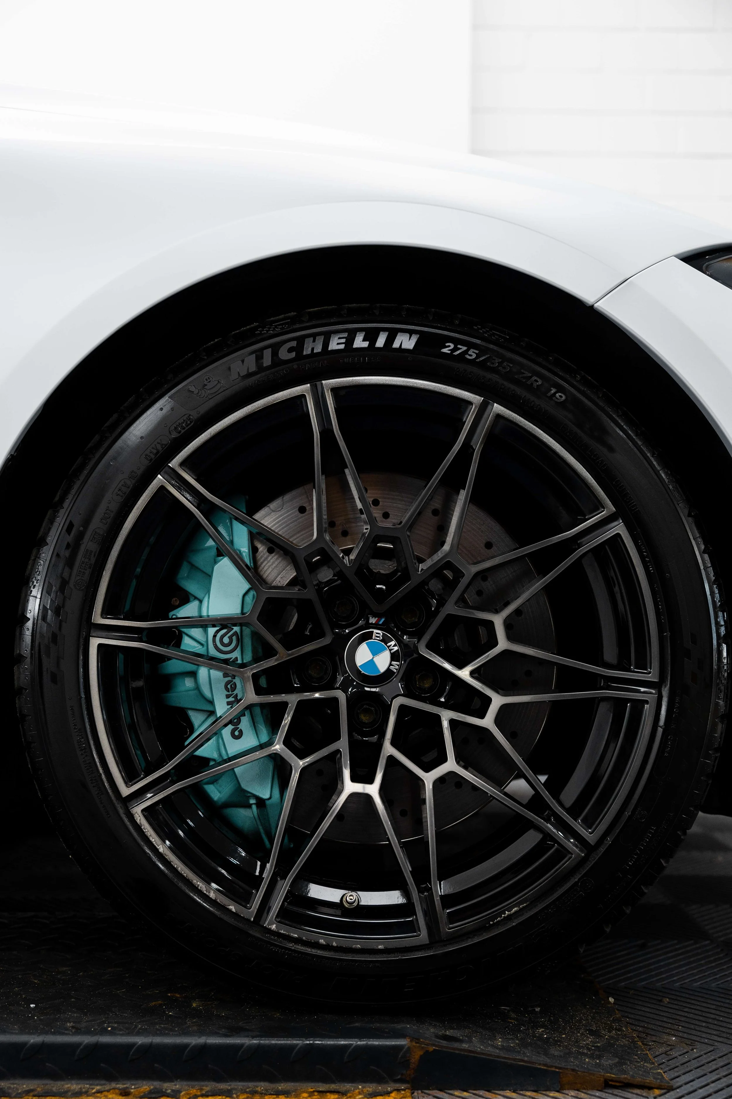 BMW M4 Competition alloy wheel and Brembo brake caliper after detailing in Mona Vale
