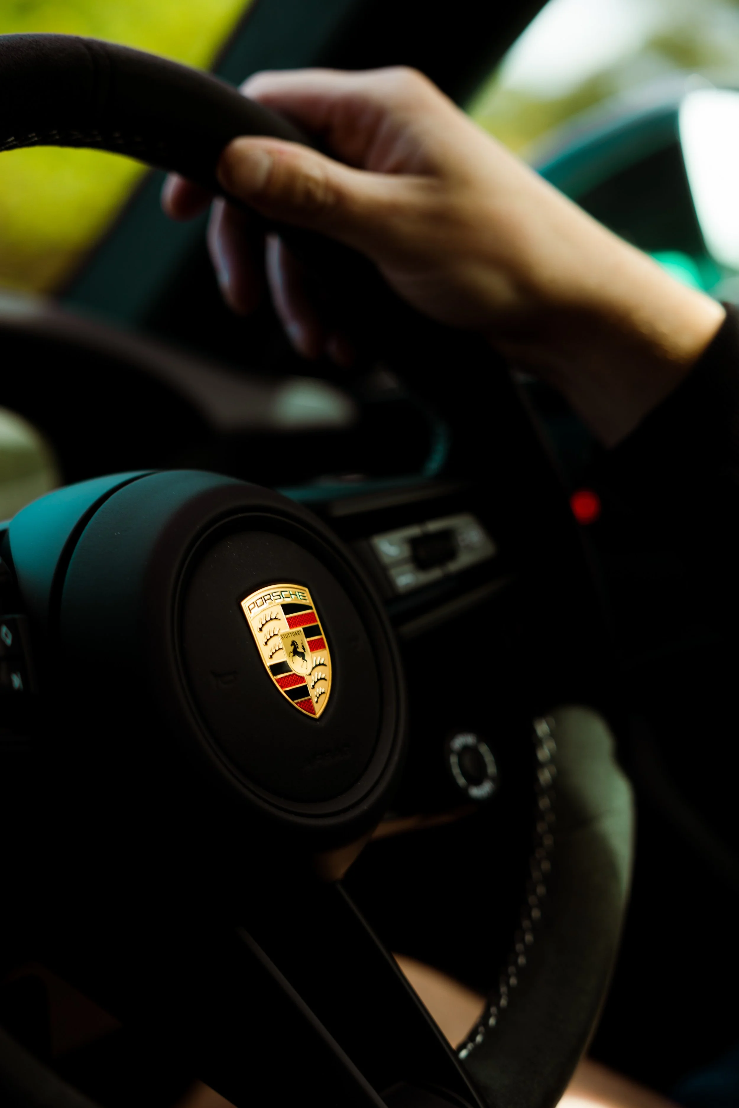 Mint green Porsche 911 GT3 interior detailing steering wheel and Porsche crest in Mona Vale