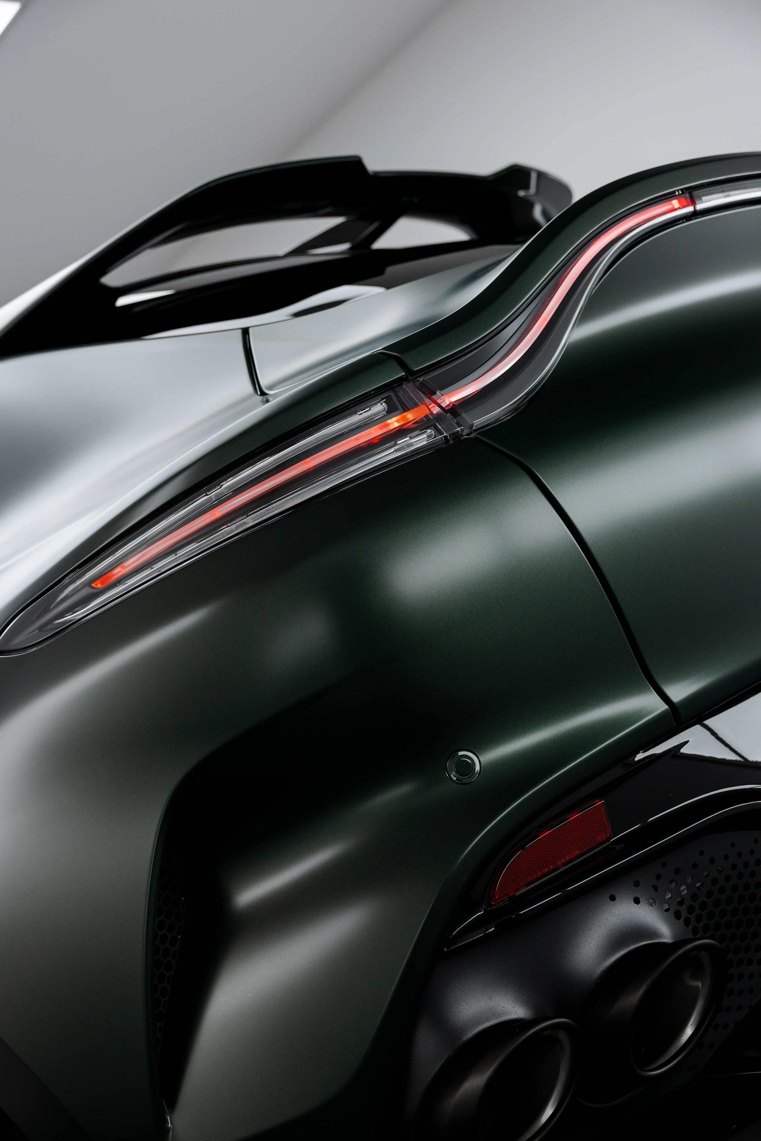 Matte green Aston Martin DBX taillight and roof spoiler with XPEL Stealth Paint Protection Film in Sydney