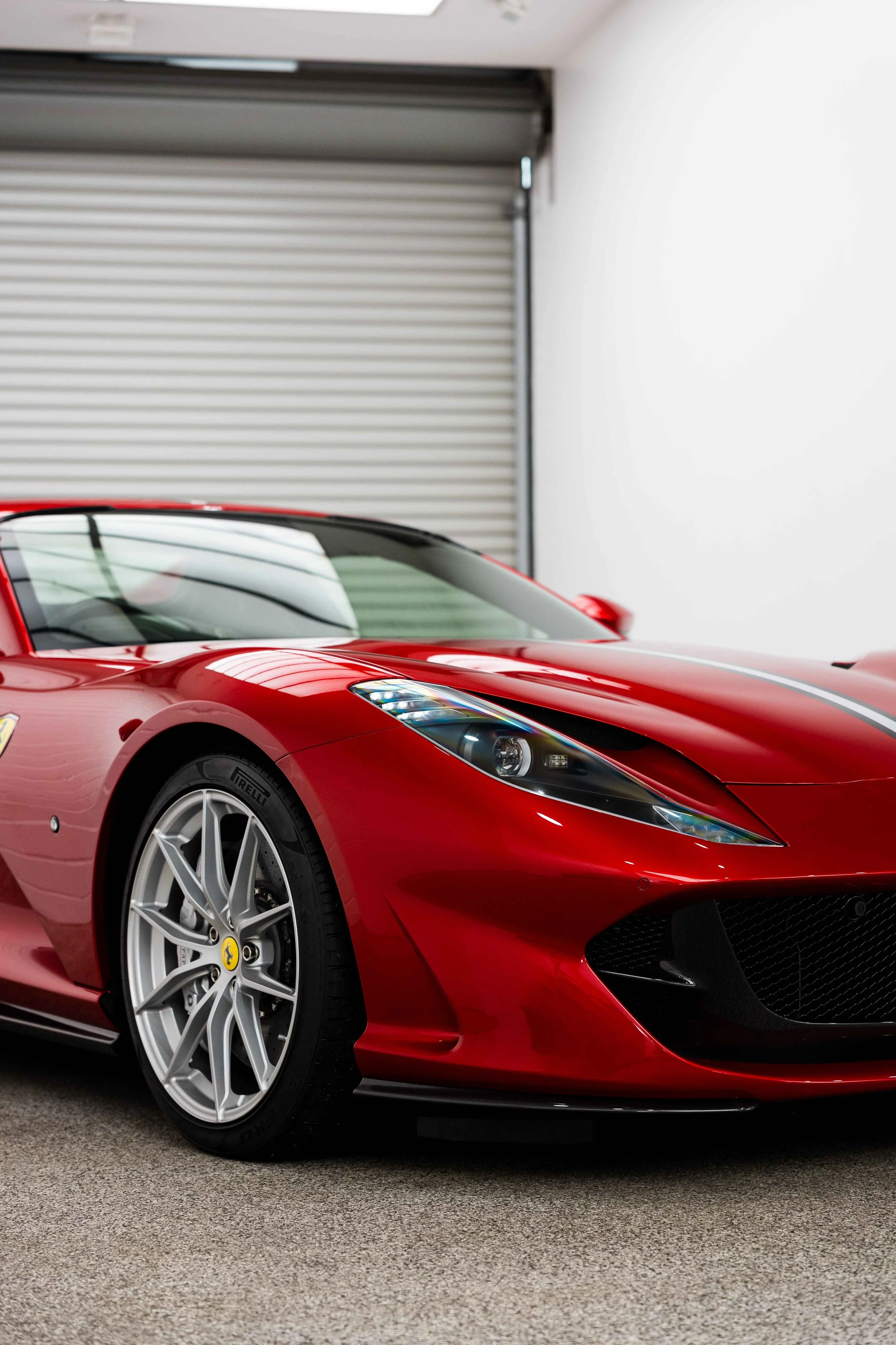 Red Ferrari 812 GTS front quarter and wheel with XPEL Paint Protection Film in Mona Vale