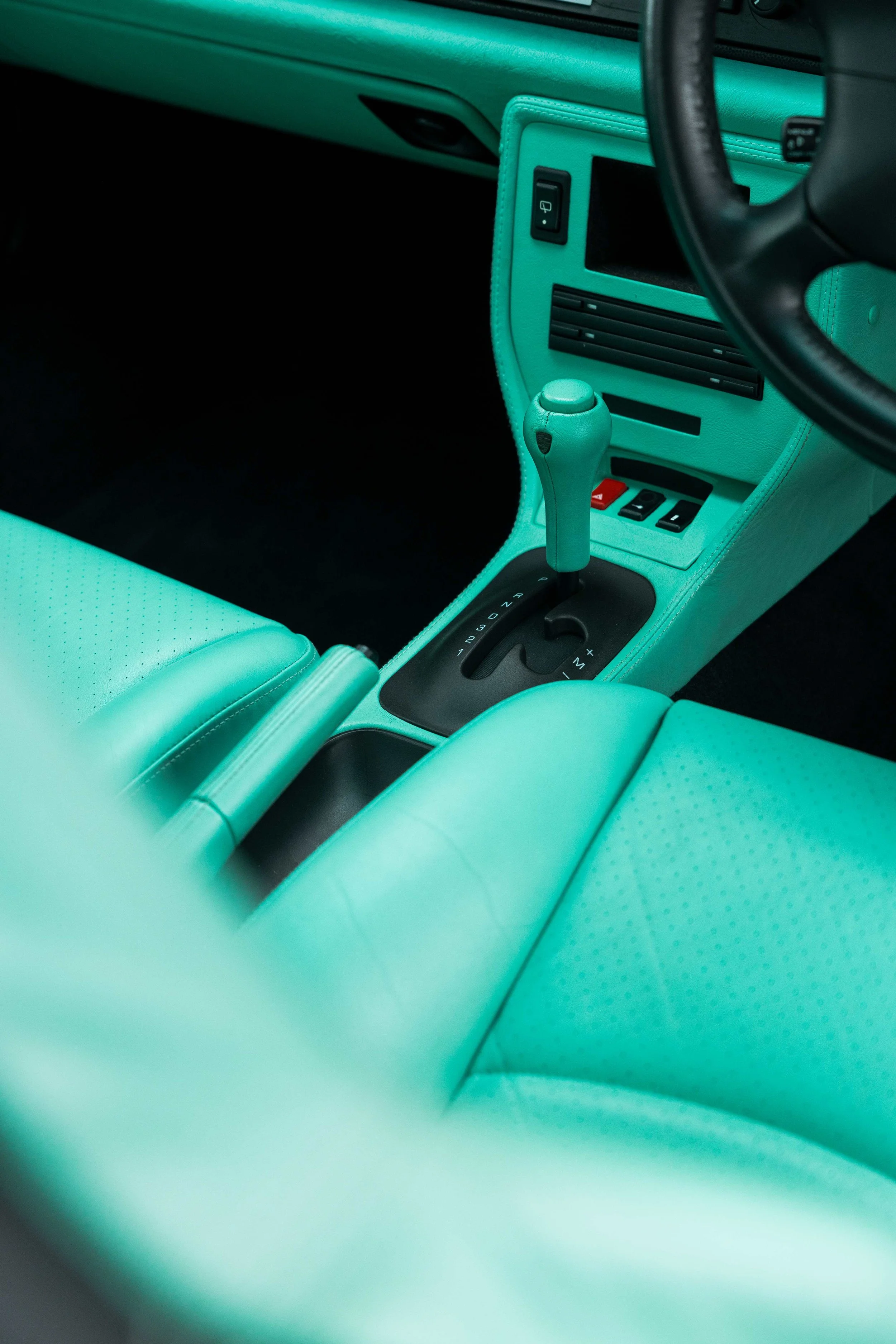 Mint green Porsche 993 gear selector and centre console after interior detailing in Mona Vale