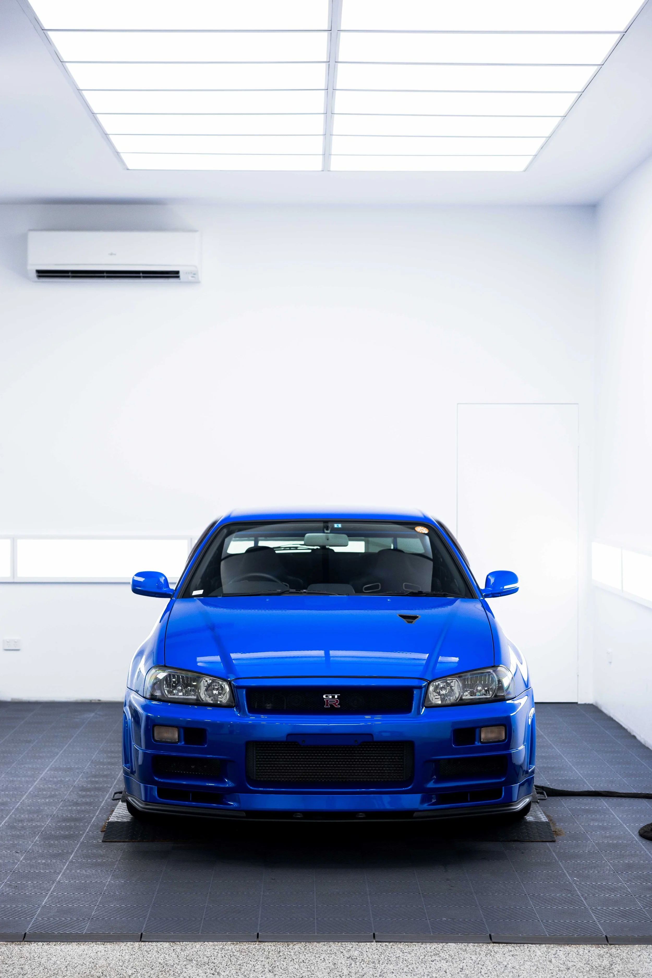 Bayside blue Nissan R34 GT-R Nur front end with XPEL Paint Protection Film in Sydney