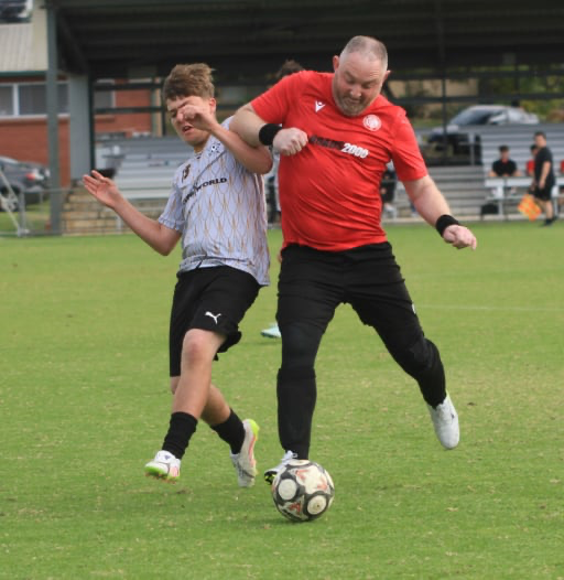 Phil Kelly playing Metro League football.