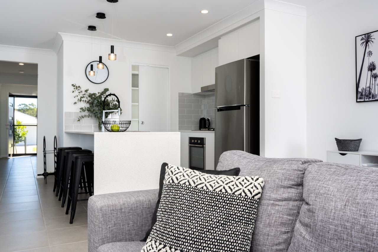 Black, white and grey kitchen with grey sofa_Carnelian Projects.jpg