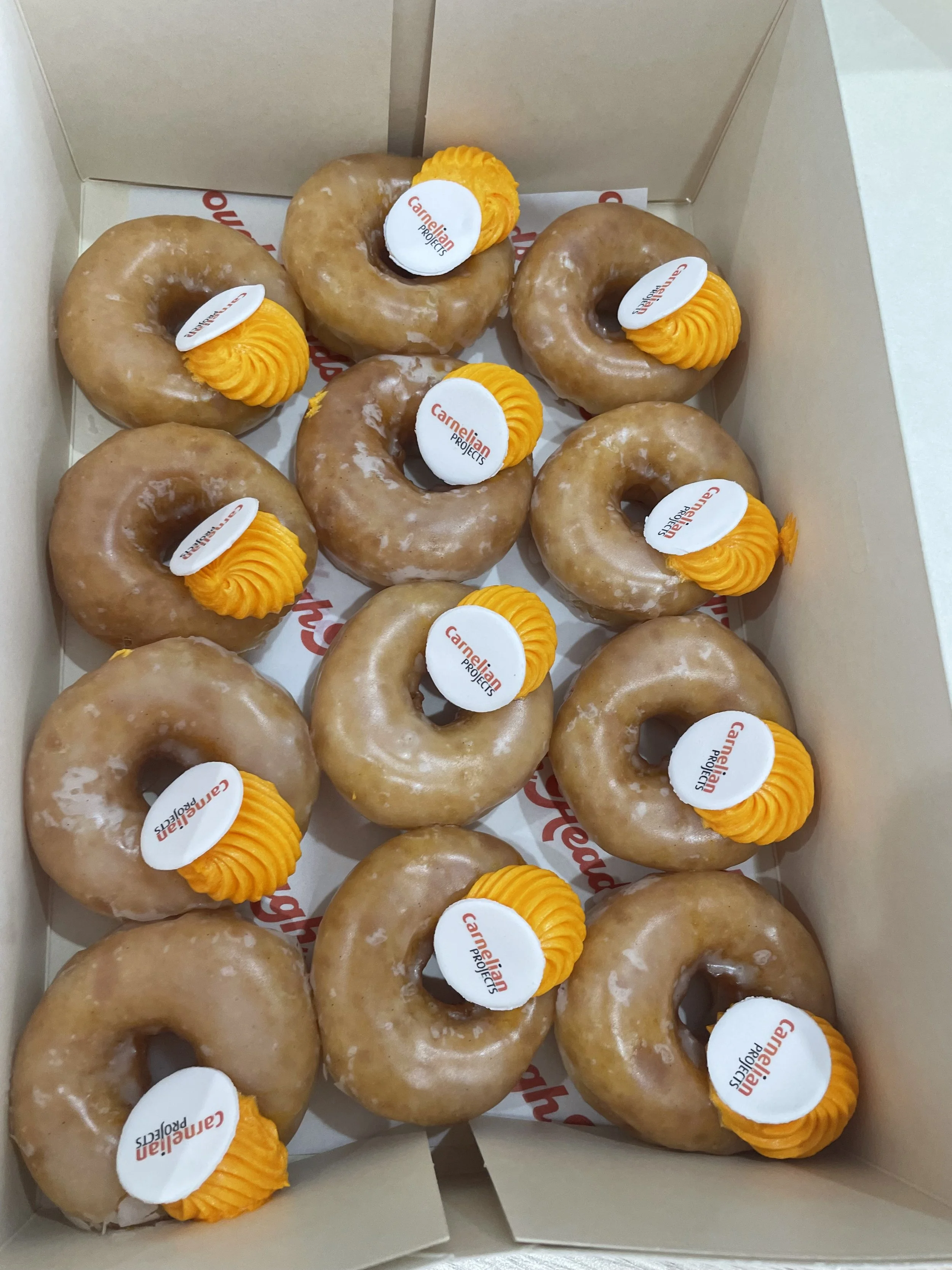 A Girl and an Orange Suit Delivers Donuts