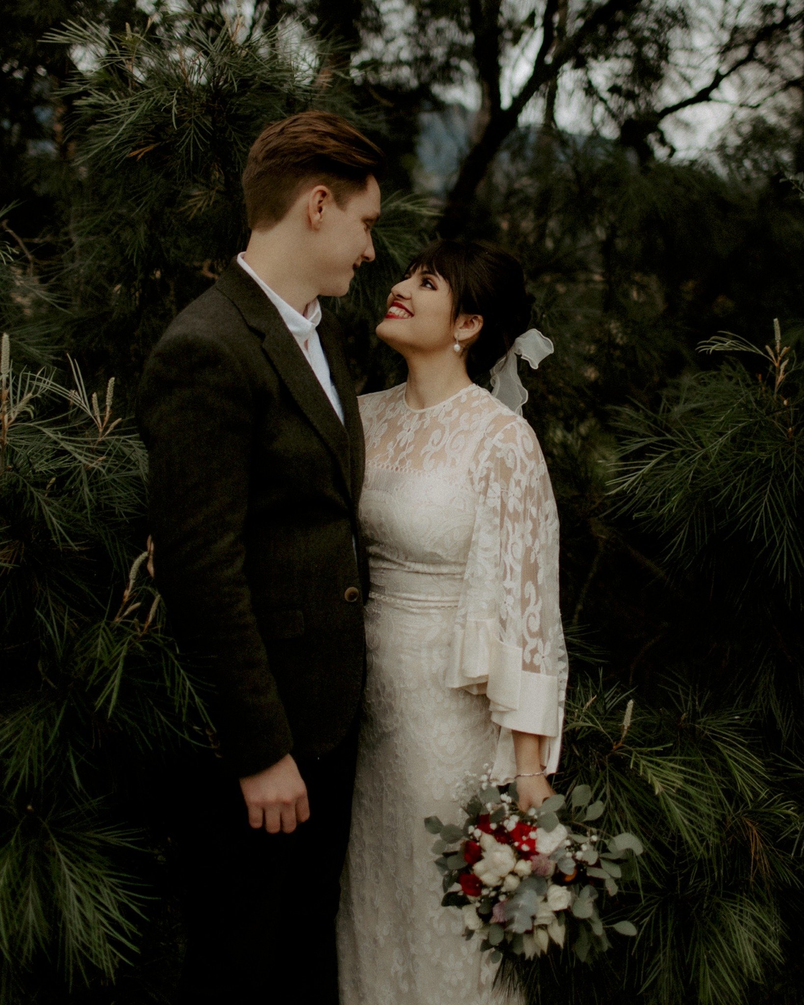 Winter air on their breath, firelight on their faces. Grace and Tom wed in Grace's uncle&rsquo;s backyard &mdash; dogs weaving between guests, woodfired pizza warming cold hands, laughter spilling from a glowing teepee into the night.

Marquee: @sout