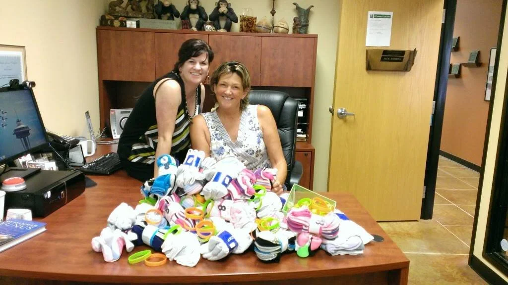 Lisa Wiscomb and Kim in Kathy Taylor's Office after a sock drive!