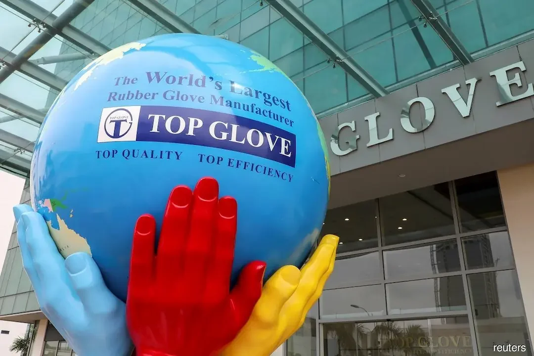 Top Glove, Malaysia, outside view of the building, plastic gloves holding the globe, with the company logo