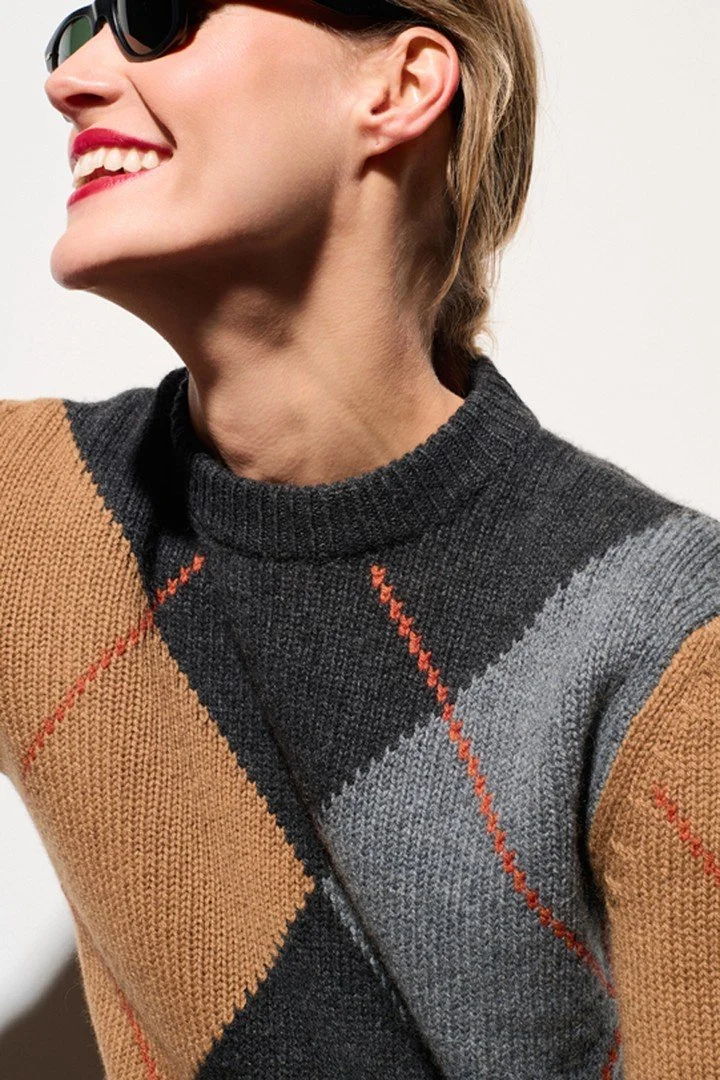 Argyle, reimagined.
A timeless diamond motif meets a bold palette of charcoal, warm camel and soft grey.
Classic knitwear, with a distinctly modern attitude.

BE YOU &mdash; Pre-Fall 2026 &middot; Cotswold Fields