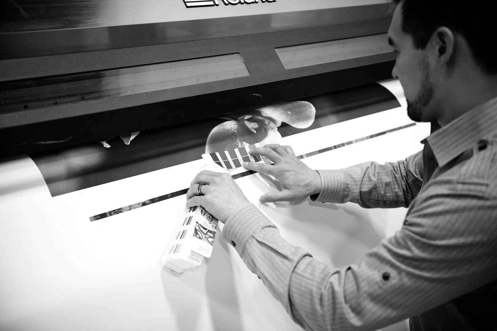 Production worker matching colors on a large scale agency project.