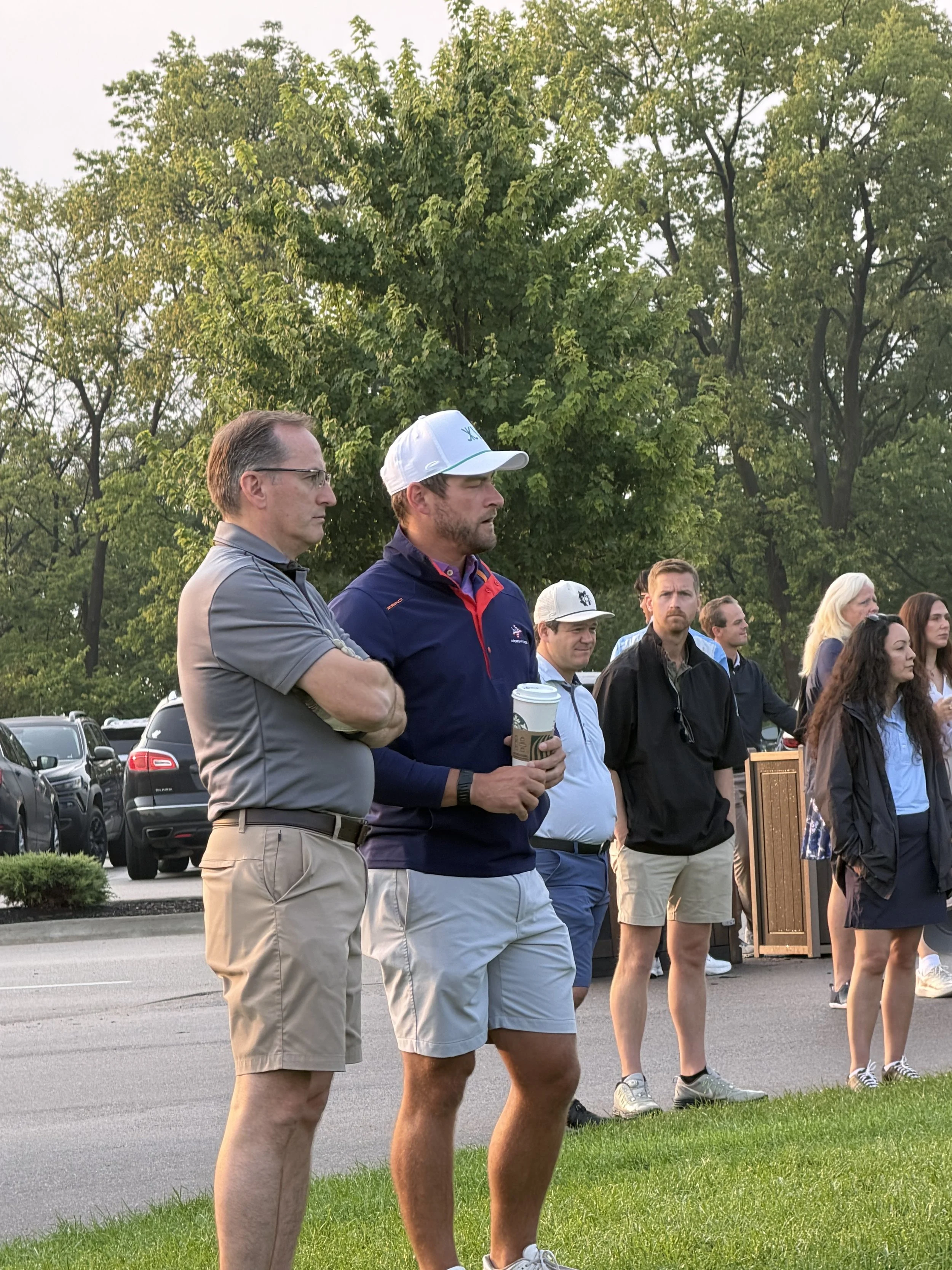 Golfers listen to opening remarks before the 2026 Walt Gutowski Sr. YMCA Golf Outing at Blythefield Country Club.