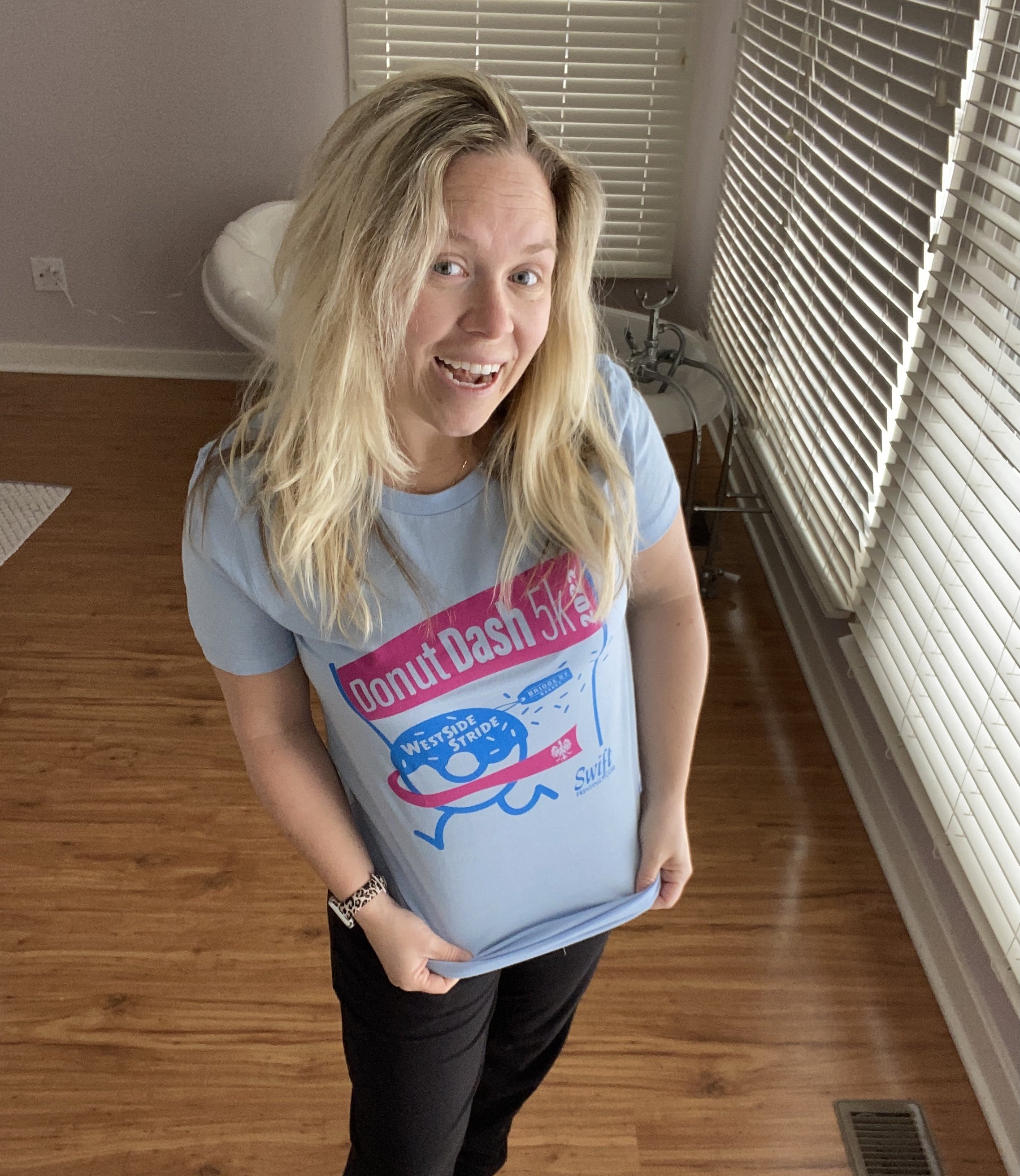 Jessica Gutowski Slaydon modeling the WestSide Stride 2022 Donut Dash TShirt that raised $235 for the Grand Rapids Police Foundation