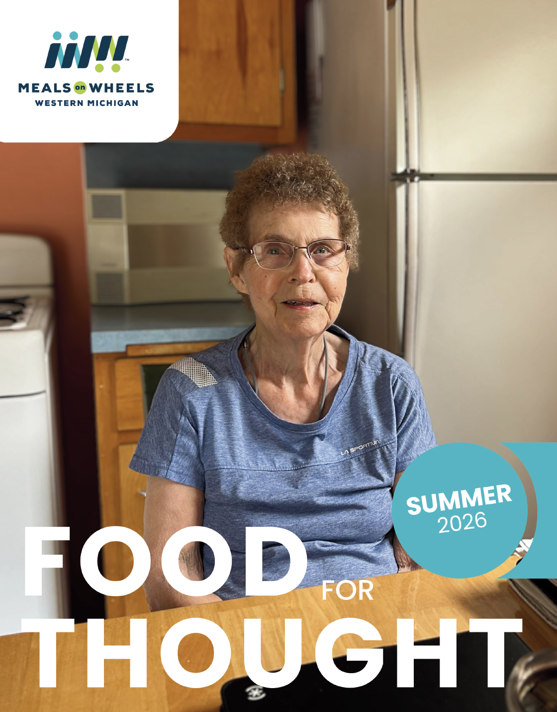 picture of a senior citizen in their kitchen smiling