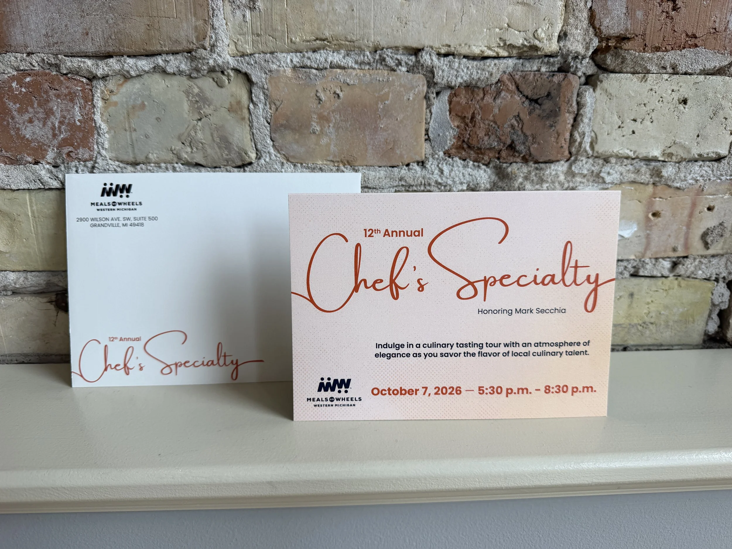 5x7 invite with envelope with brick background