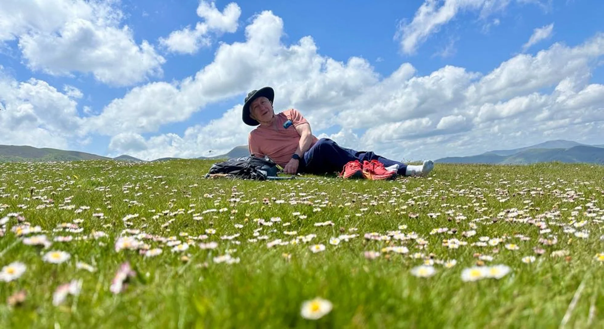 Man laying down on flower field.jpg