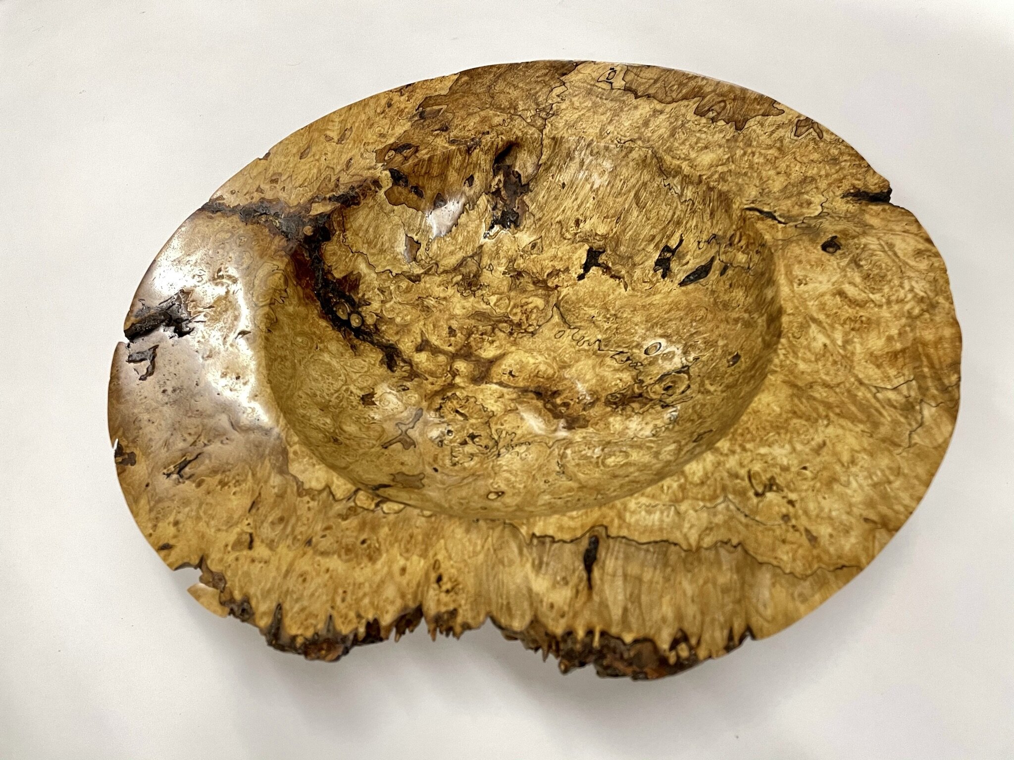 The rugged textures and the rustic beauty of bark inclusions are highlighted in this platter.   Big Leaf Maple Burl Platter  14.5” x 3” high $500 