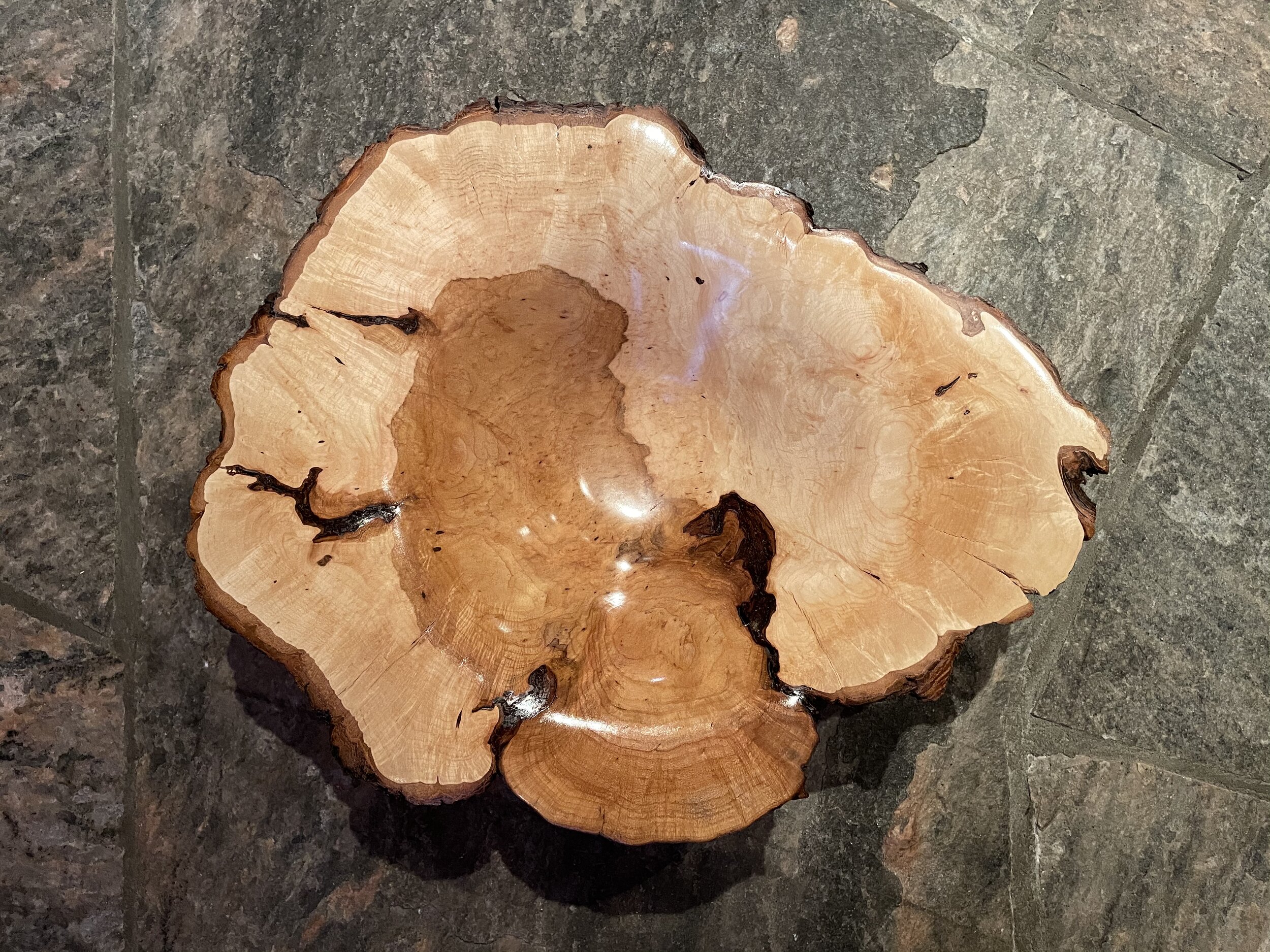  This Sugar Maple Burl Bowl displays dramatic marbling of colour, complex figuring and a lustrous food-safe finish.  17” round x 4.5” high, $600 