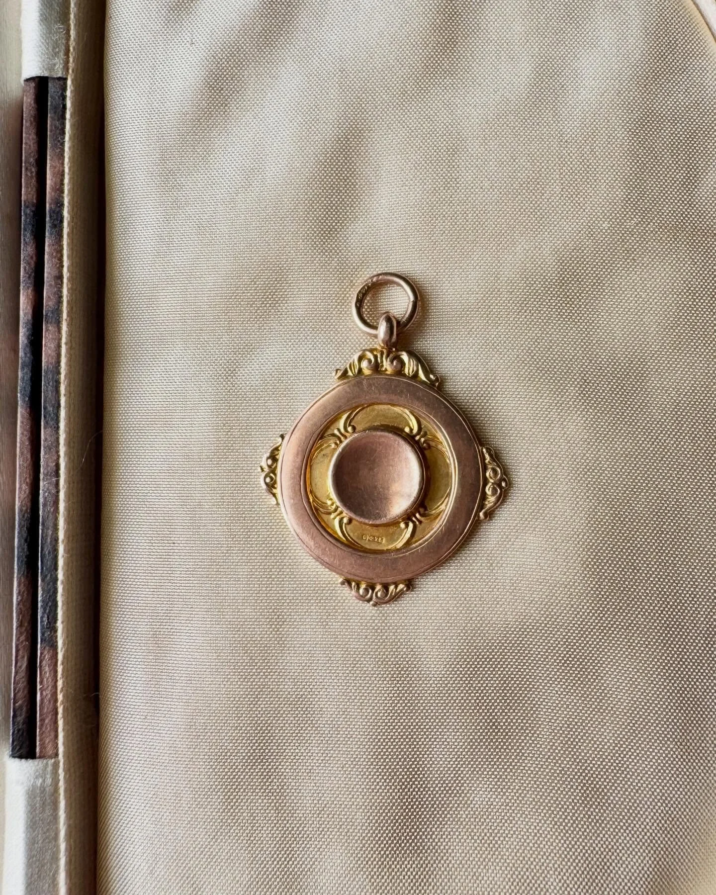 I think I&rsquo;ll regret this! Today we have a fabulous Art Deco medal fob crafted in 9ct yellow gold by Thomas Fattorini &amp; Sons Ltd. It has a fabulous, organic design with an Art Nouveau vibe. Its rich yellow glow means it could easily be mista