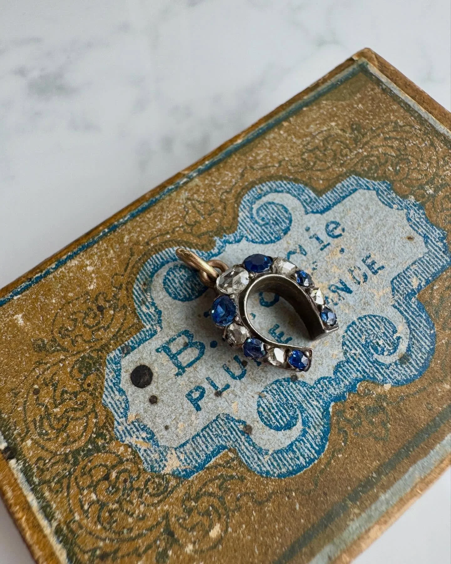 Fabulous baby antique horseshoe charm - available now! Moody diamonds &amp; cornflower blue sapphires - sooo lovely! 🐎 I&rsquo;ll link it in Stories shortly 💙

#joaniesjewels 
#oldcutdiamonds 
#antiquejewelry