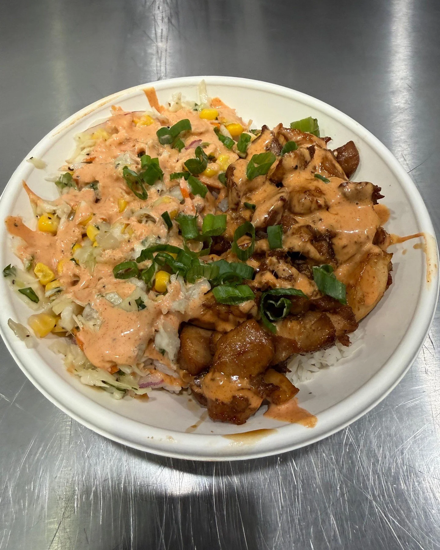 Bourbon Chicken Rice Bowl: only at @theyardonbroadway on Mondays and Tuesdays! White rice, citrus slaw, bourbon chicken, Creole yum yum and green onion. $15.50 for lunch and dinner at The Yard!