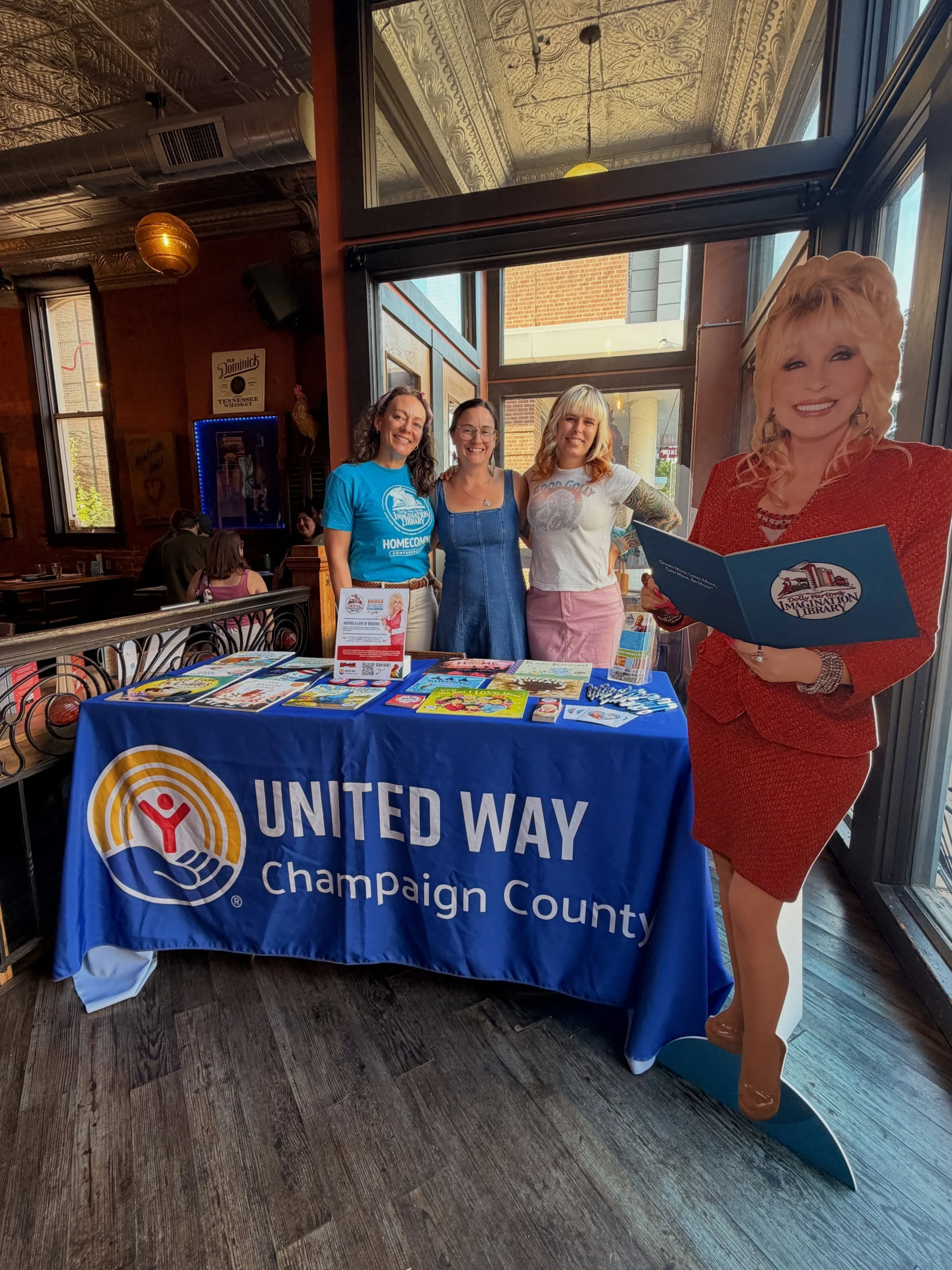 @uwchampaign is in the house! Providing info and accepting donations for Dolly&rsquo;s Imagination Library! They&rsquo;ll be here until 8 or so. Stop by and have a Rhinestone Queen Slush or the Jolene Cocktail.