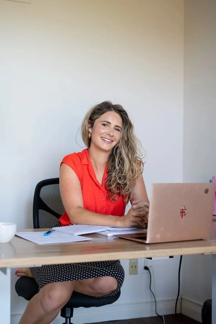 leah brueggemann functional practitioner sitting behind desk