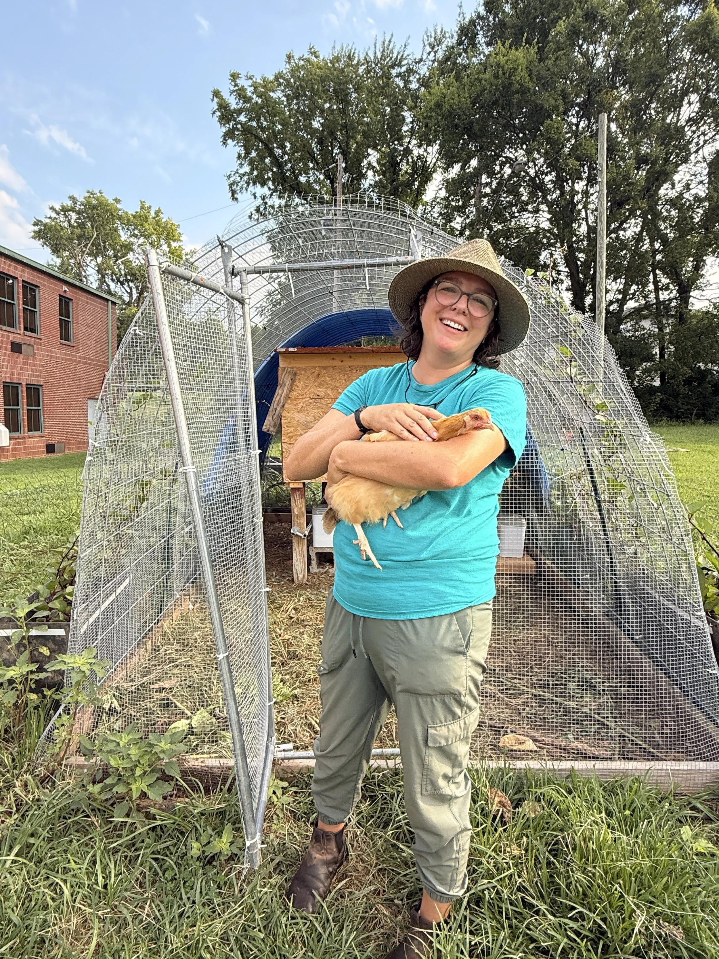 woman smiling with chicken