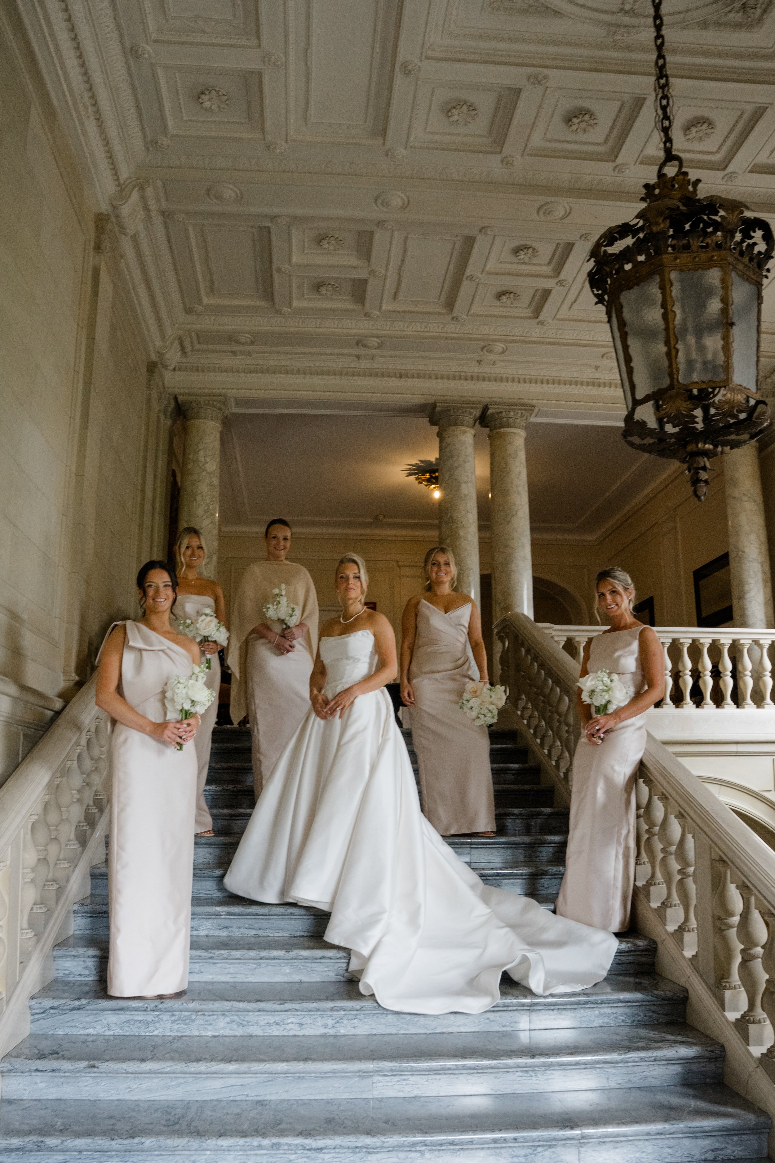 Bridesmaids and Bride on stairs