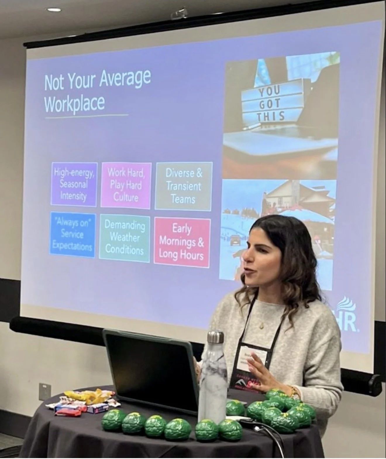 Beata gives presentation in front of Powerpoint slides