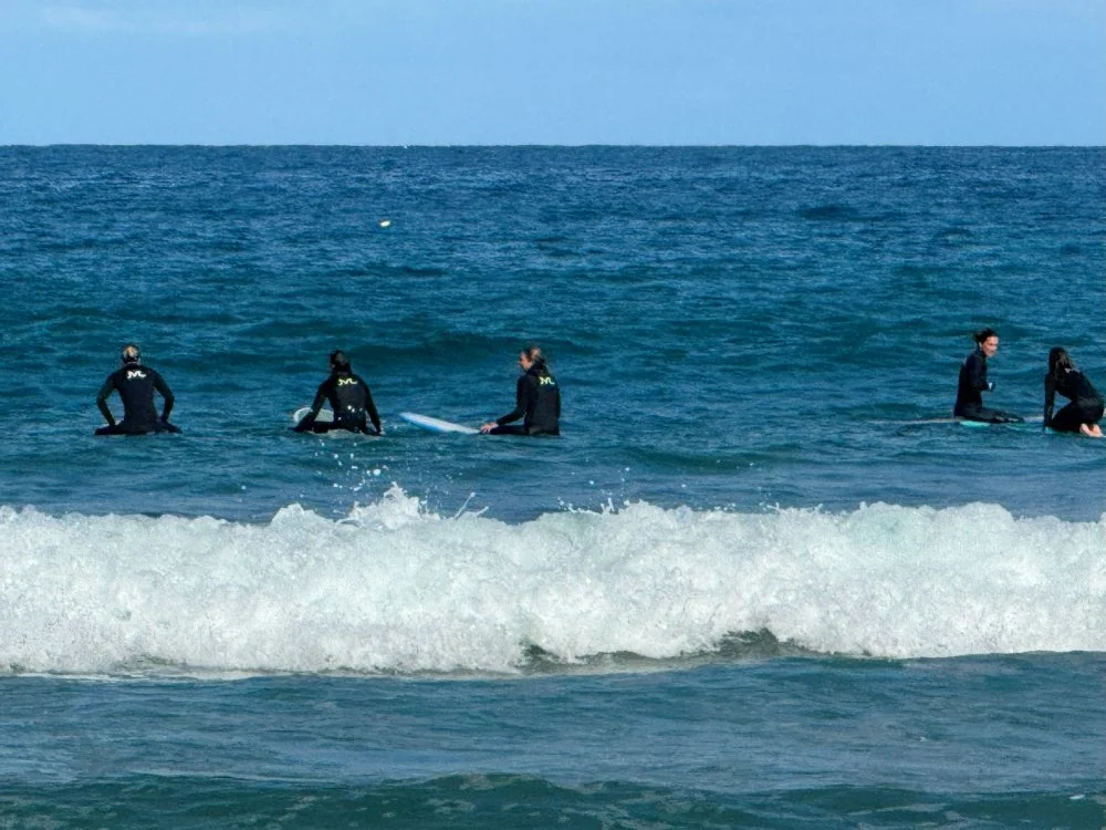 Picture of the Mamala Surf team at Scripps Beach for a team surf and beach cleanup