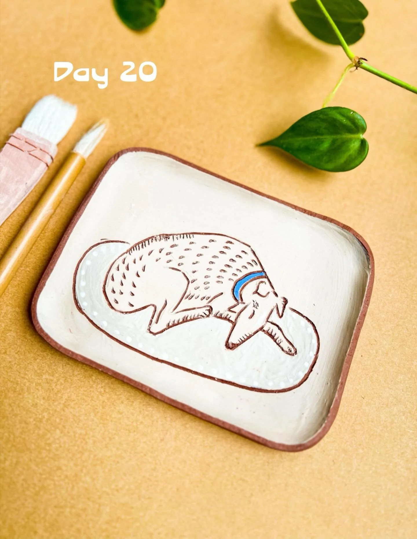 Day 20 of #the100dayproject 🌿Slwwping Dog Dish in greenware #slabbuiltceramics #carvedclay #draweveryday