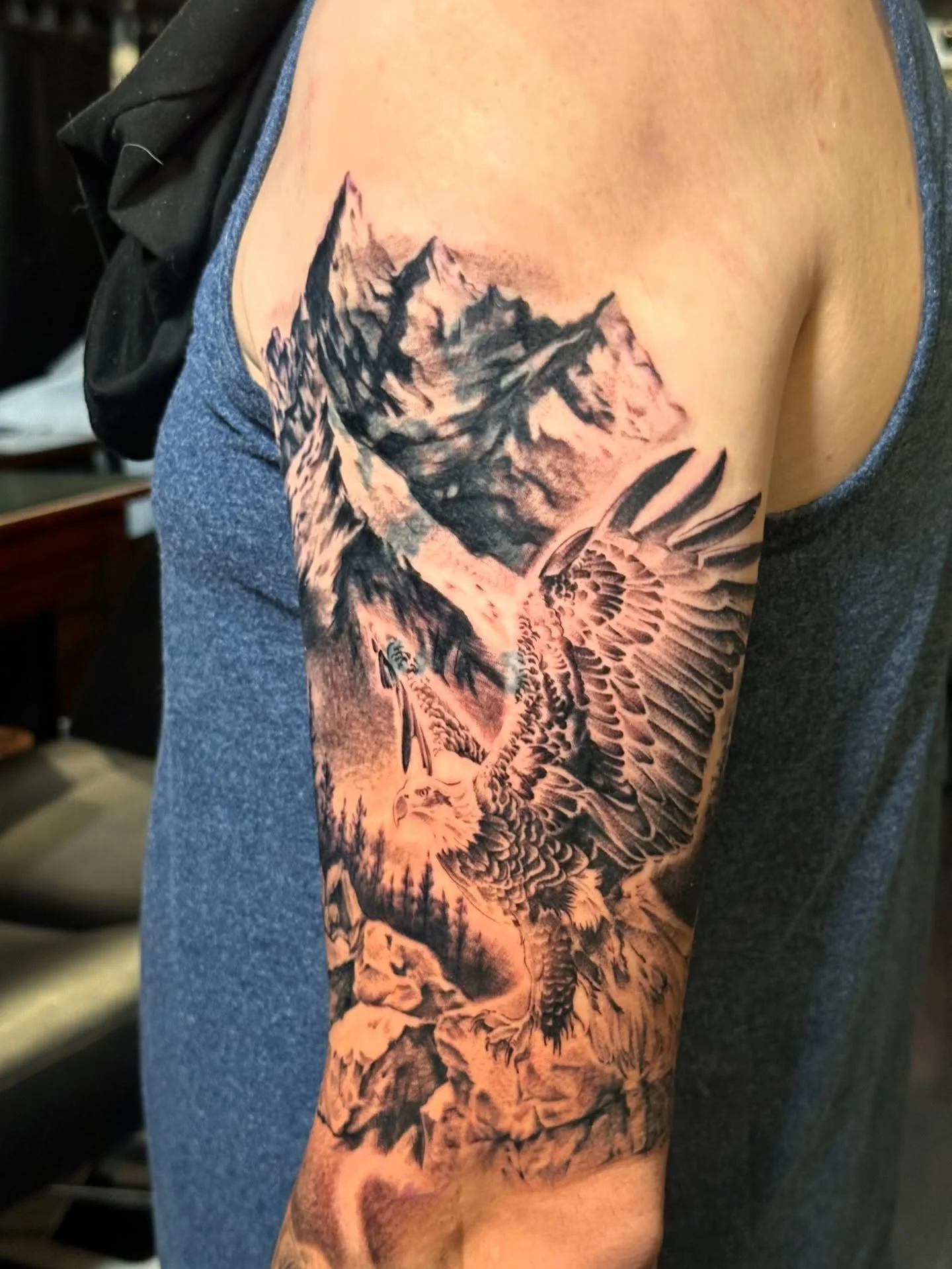 Turned an old story into something timeless. Full landscape cover-up in black &amp; grey.
.
.
.
#BlackAndGreyRealism #CoverUpTattoo #RealismTattoo #TattooSleeve #LandscapeTattoo #TattooArtist #TattooArt #BlackAndGrey #CustomTattoo #EagleTattoo #SanDi