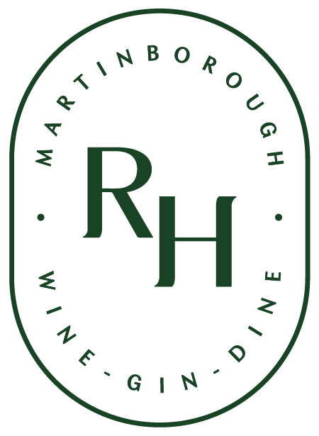 The Runholder icon Logo with a green oval border that reads "Martinborough Wine - Gin - Dine" and has the initials "R H" in the center.