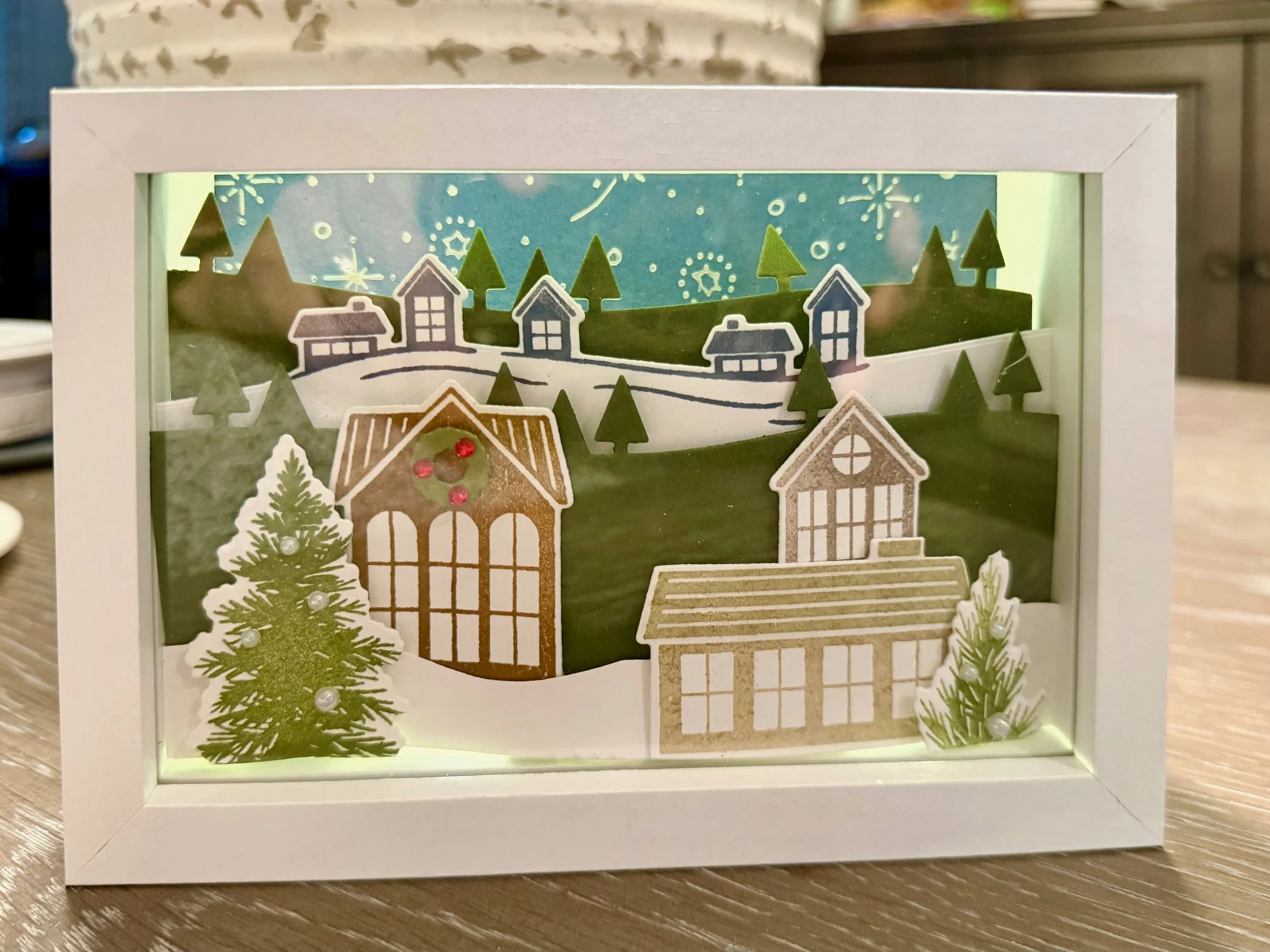 Welcome noel Stampin' Up shadow box with foiled snowflakes and houses winter scene