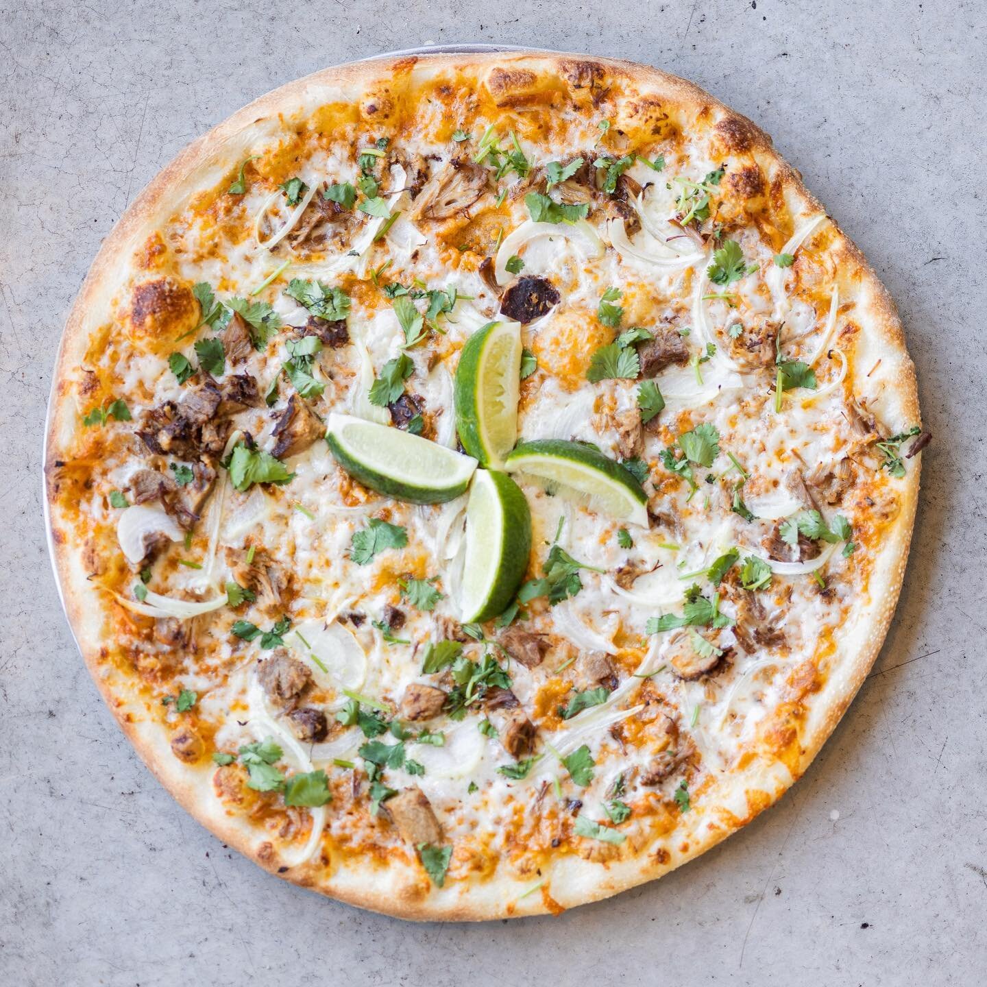 STREET TACO PIZZA: Roasted salsa, mozzarella, carnitas pork, onion, cilantro, &amp; lime wedges!

Available by the slice every Tuesday and Thursday, and as a full pizza 7 days a week now through September! 

#luckyslice #luckyslicepizza #pizzatildeat