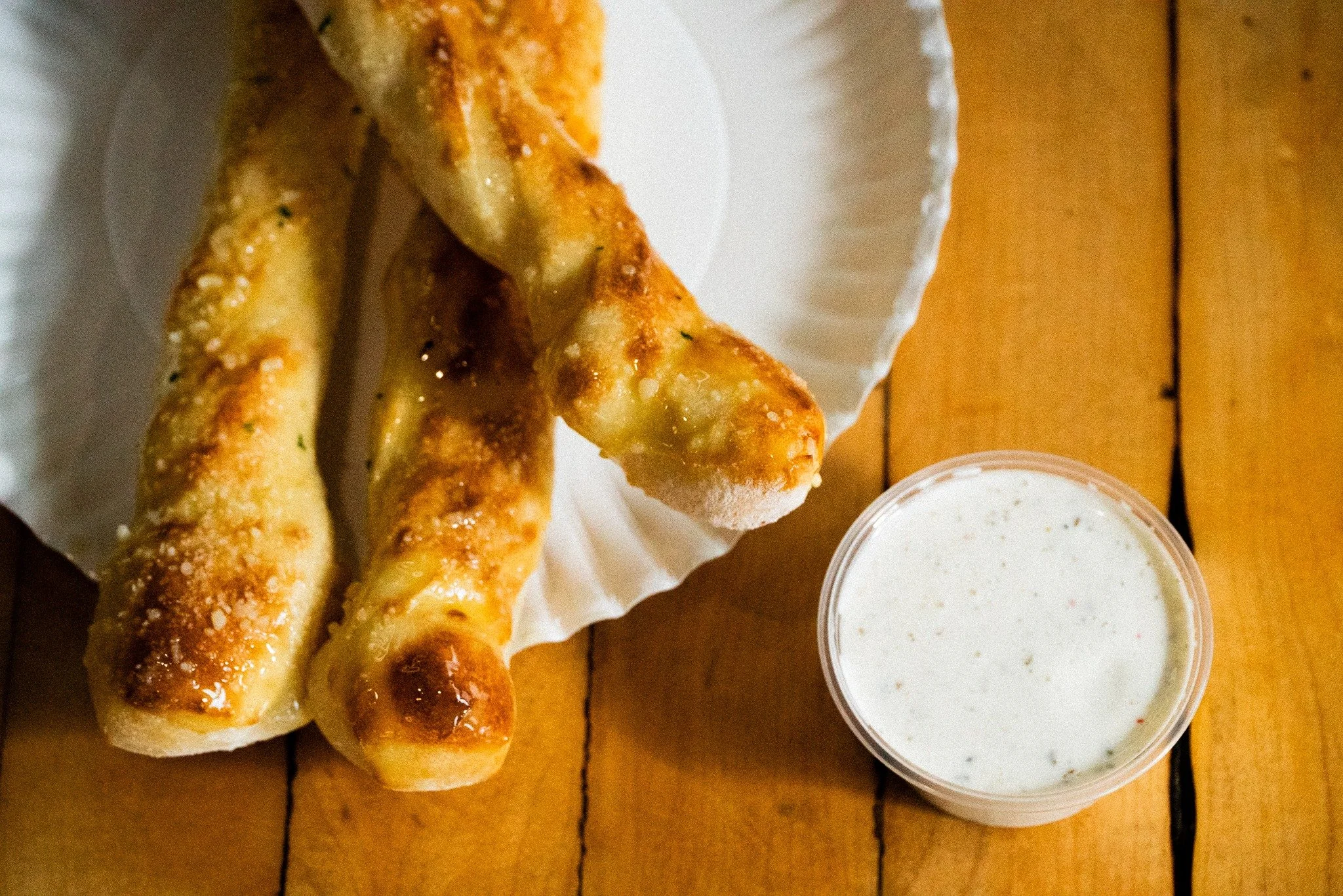 Some things are just made for each other. Sometimes, it's people. Sometimes, is breadsticks and ranch. Here's something special for all those Lucky Slice lovers. 

We just uploaded a coupon for a FREE BREADSTICK to all Lucky Slice Pizza App users. Va