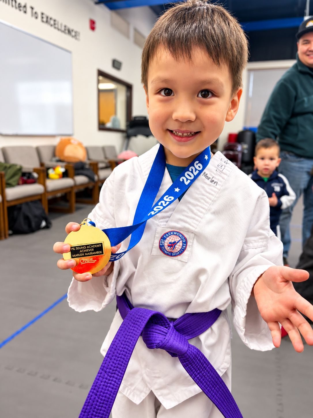 Young TKD champion showing medal