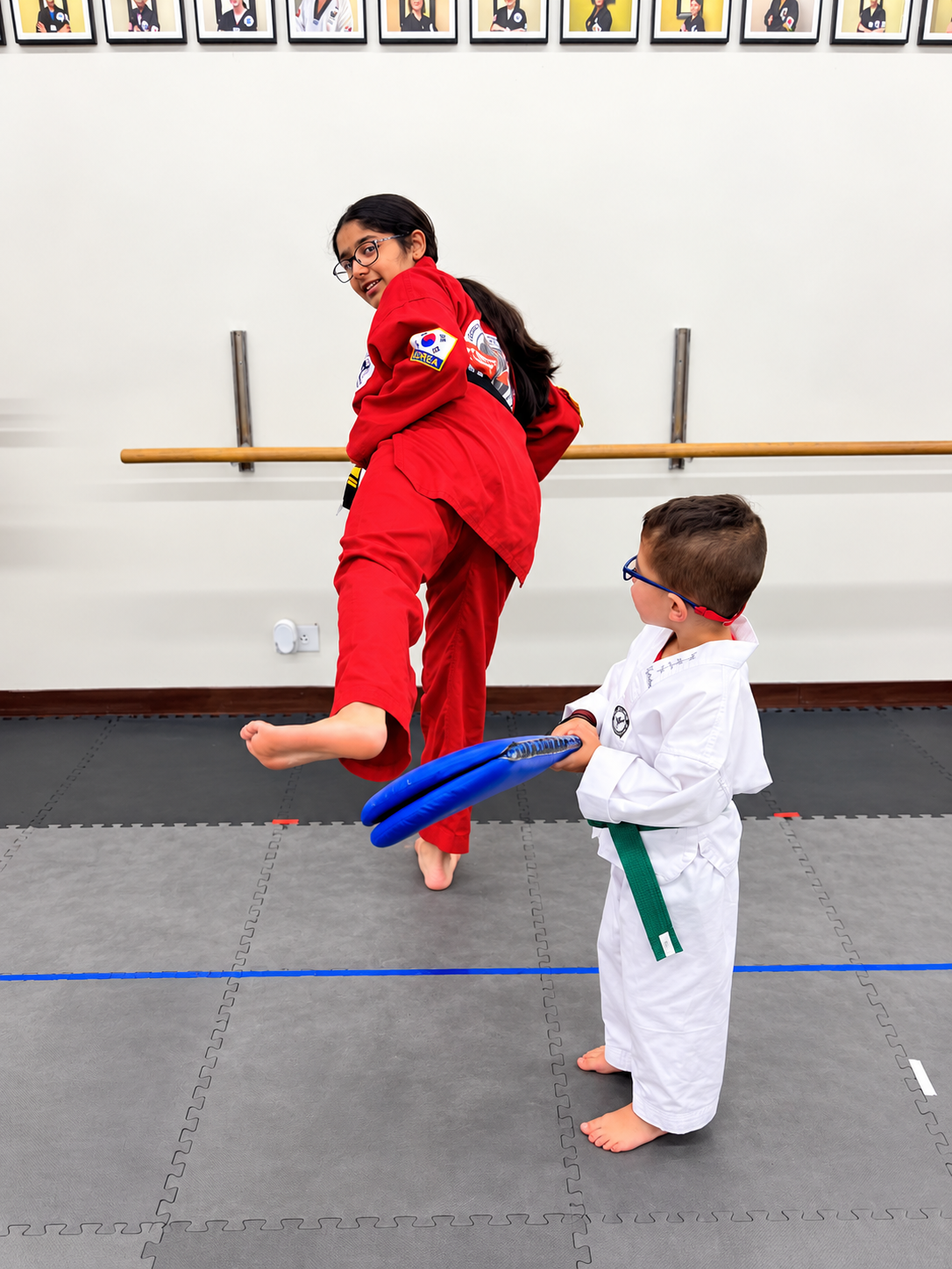 Young martial artist practices a kick