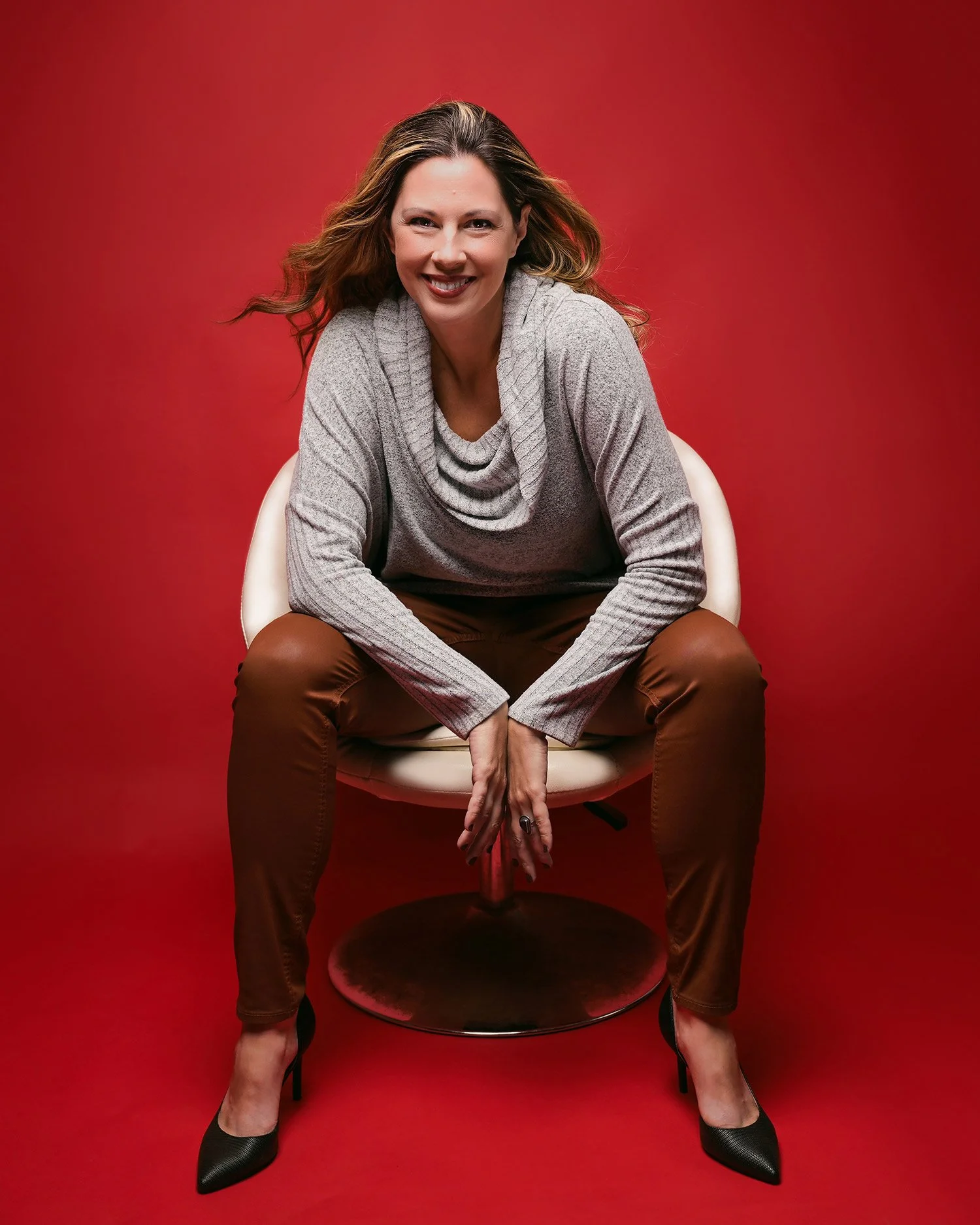 Bright color backdrop of female actress headshot session