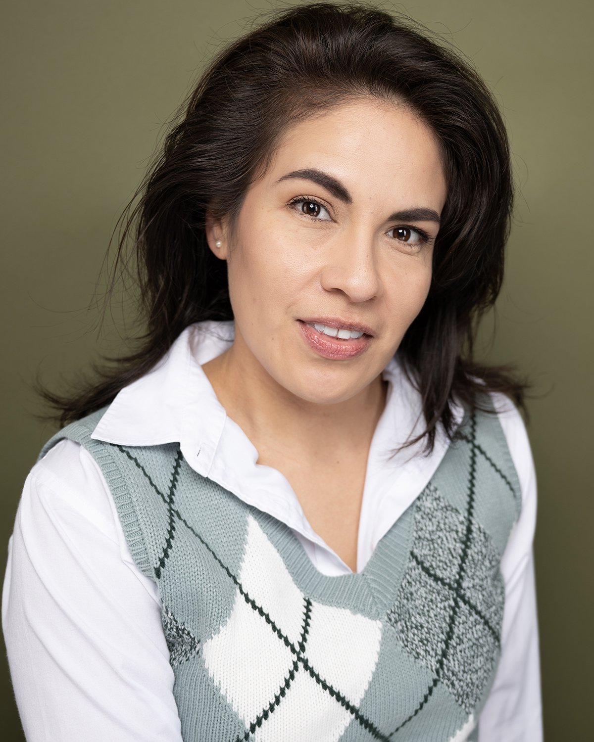 Studio portrait session with colored backdrop