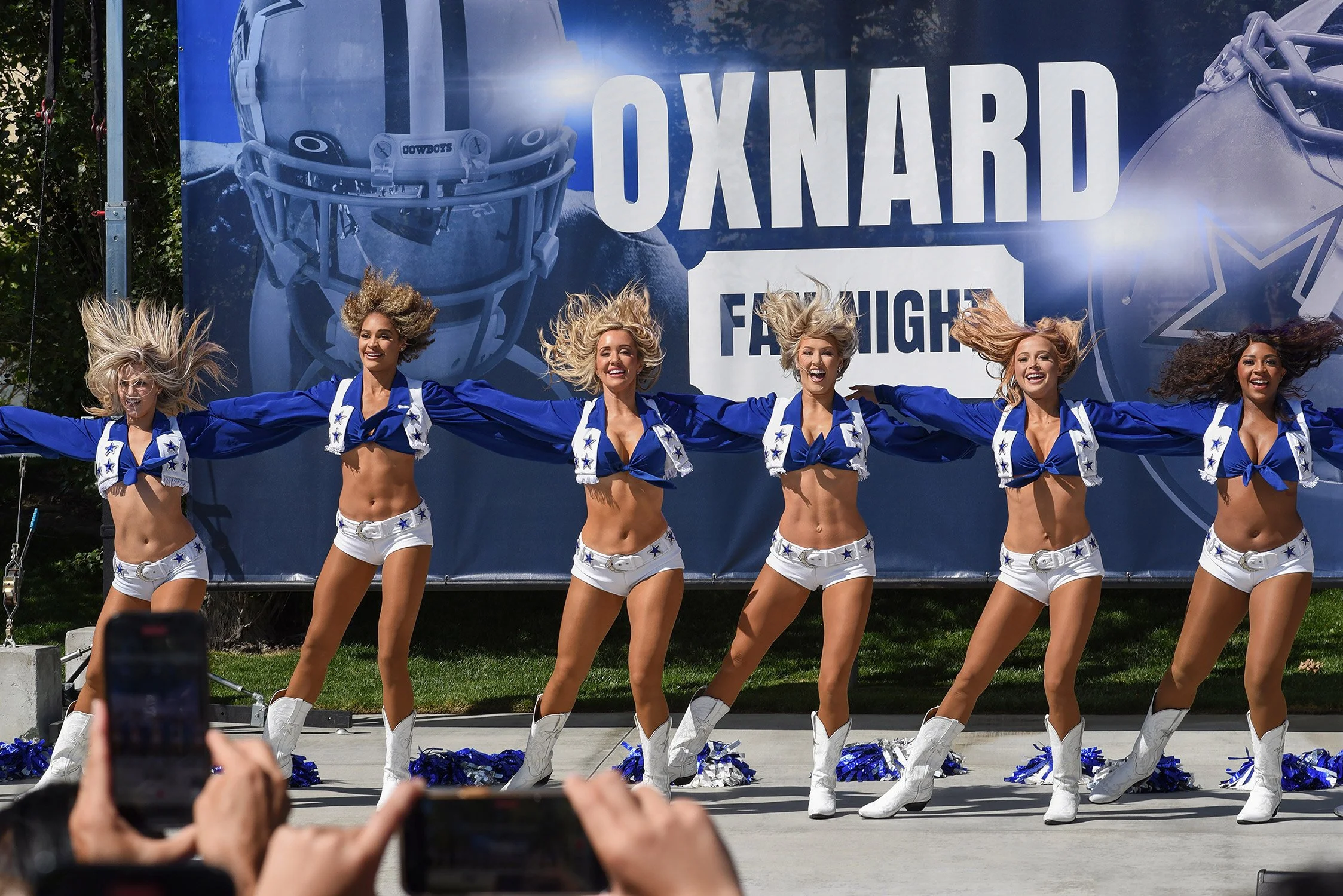 Dallas Cowboy Cheerleads pack in a crowd at event in oxnard