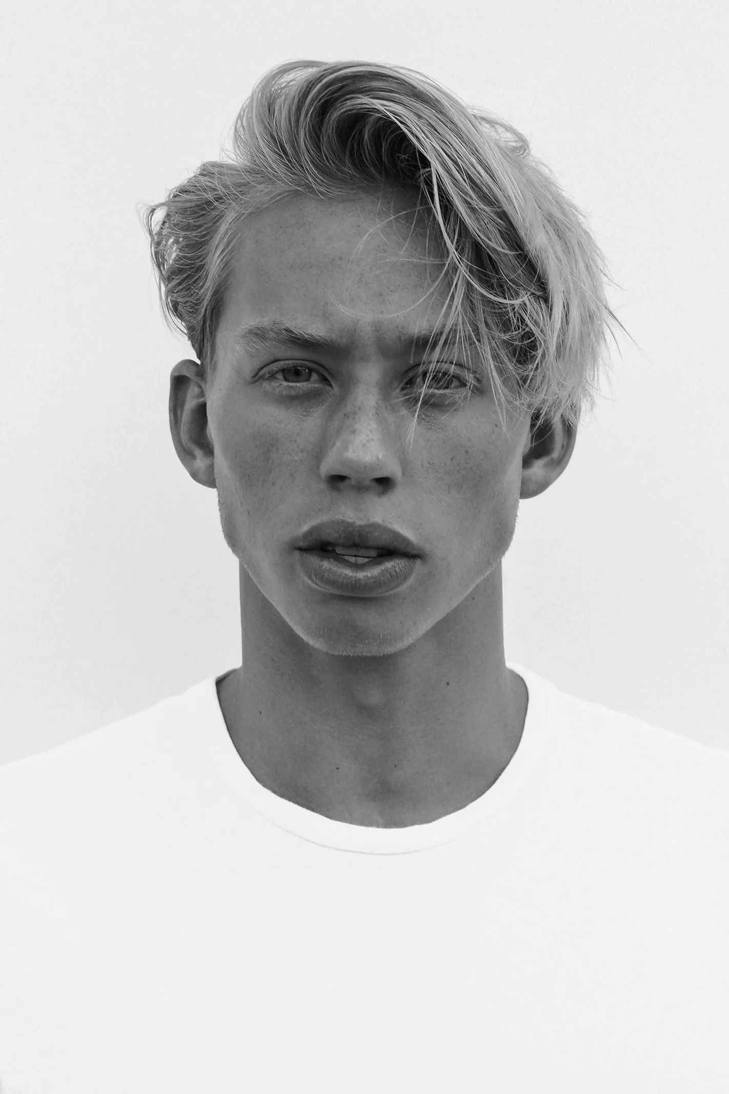 dramatic black and white headshot for young male model