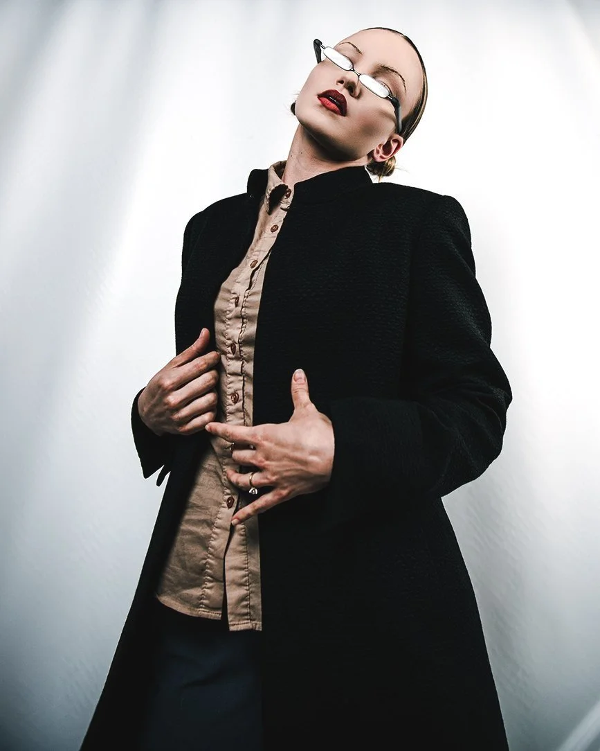 female model in designer trench coat models stylish eye wear