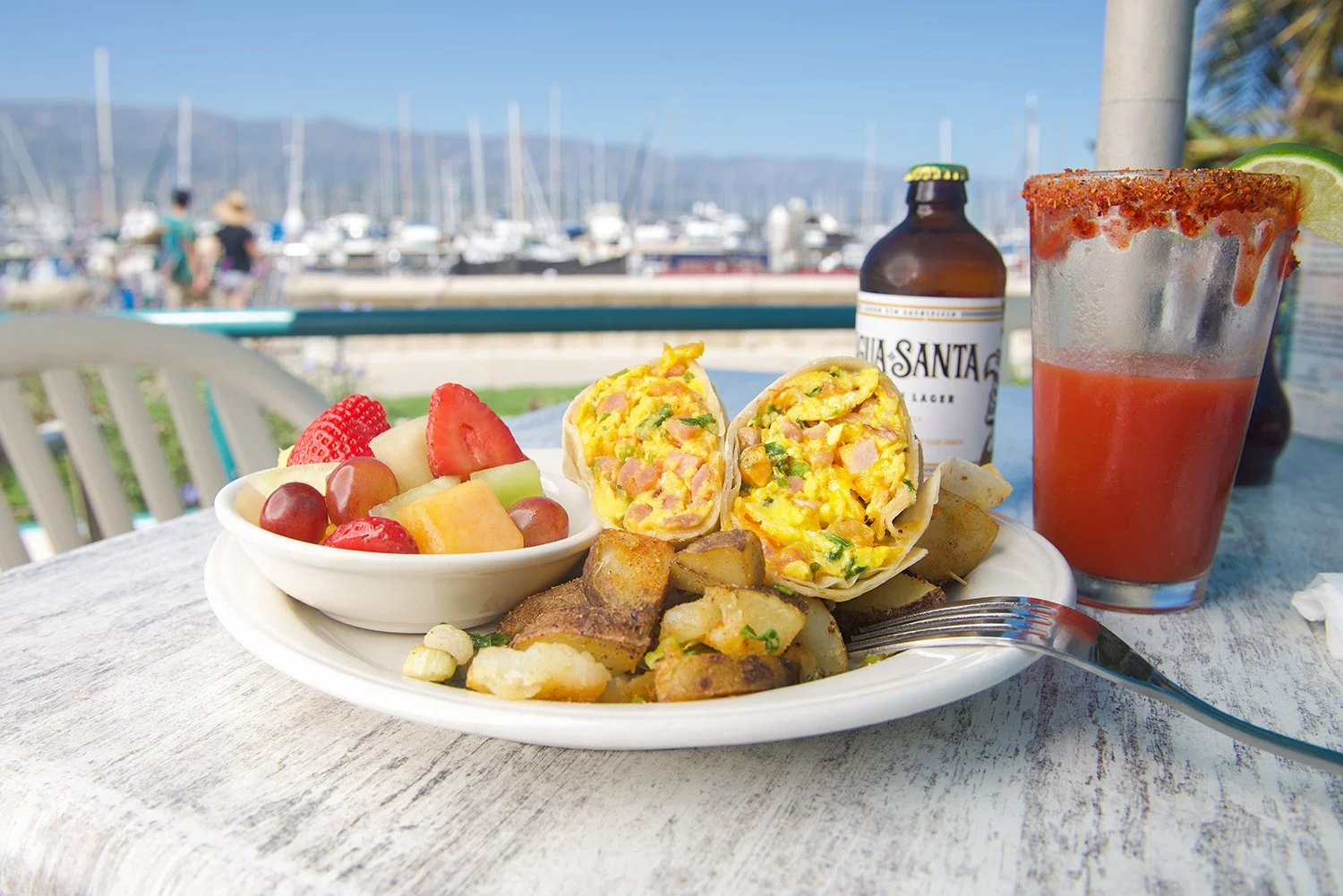 breakfast burrito and a beer with a harbor restaurant view