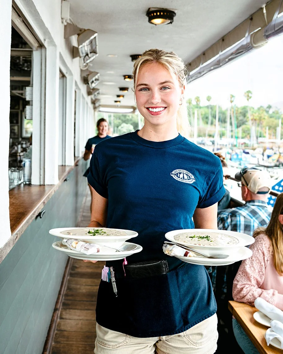 Guests enjoying patio dining near the harbor in Santa Barbara